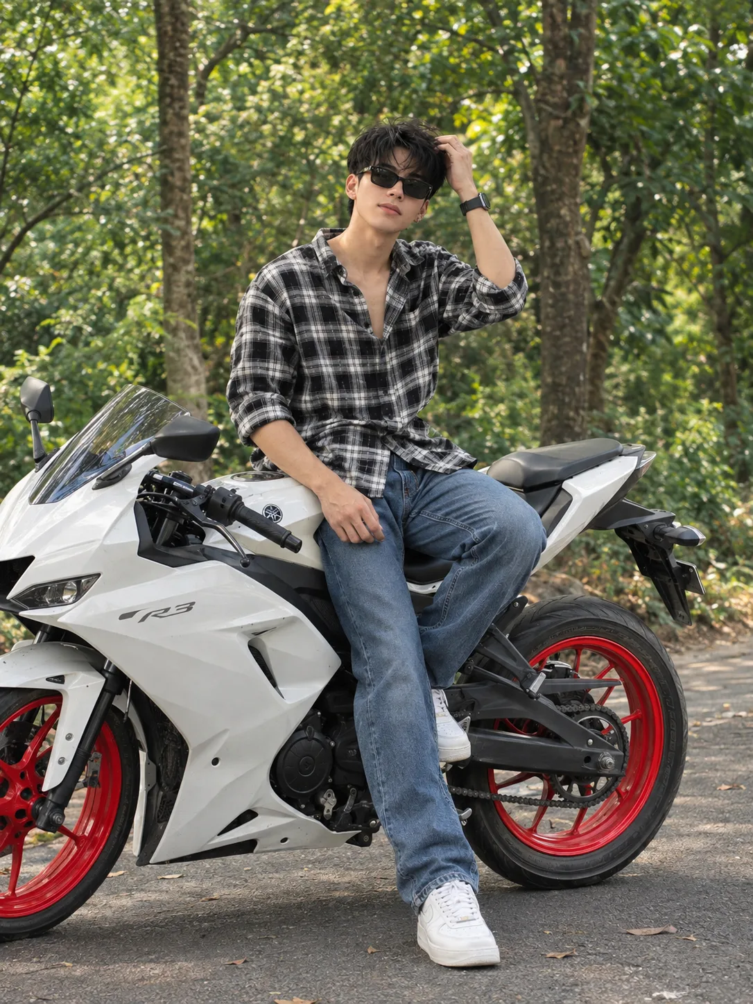 Ultra-realistic full-body DSLR fashion photograph of a stylish young Indian man sitting confidently on a modern white sport motorcycle with