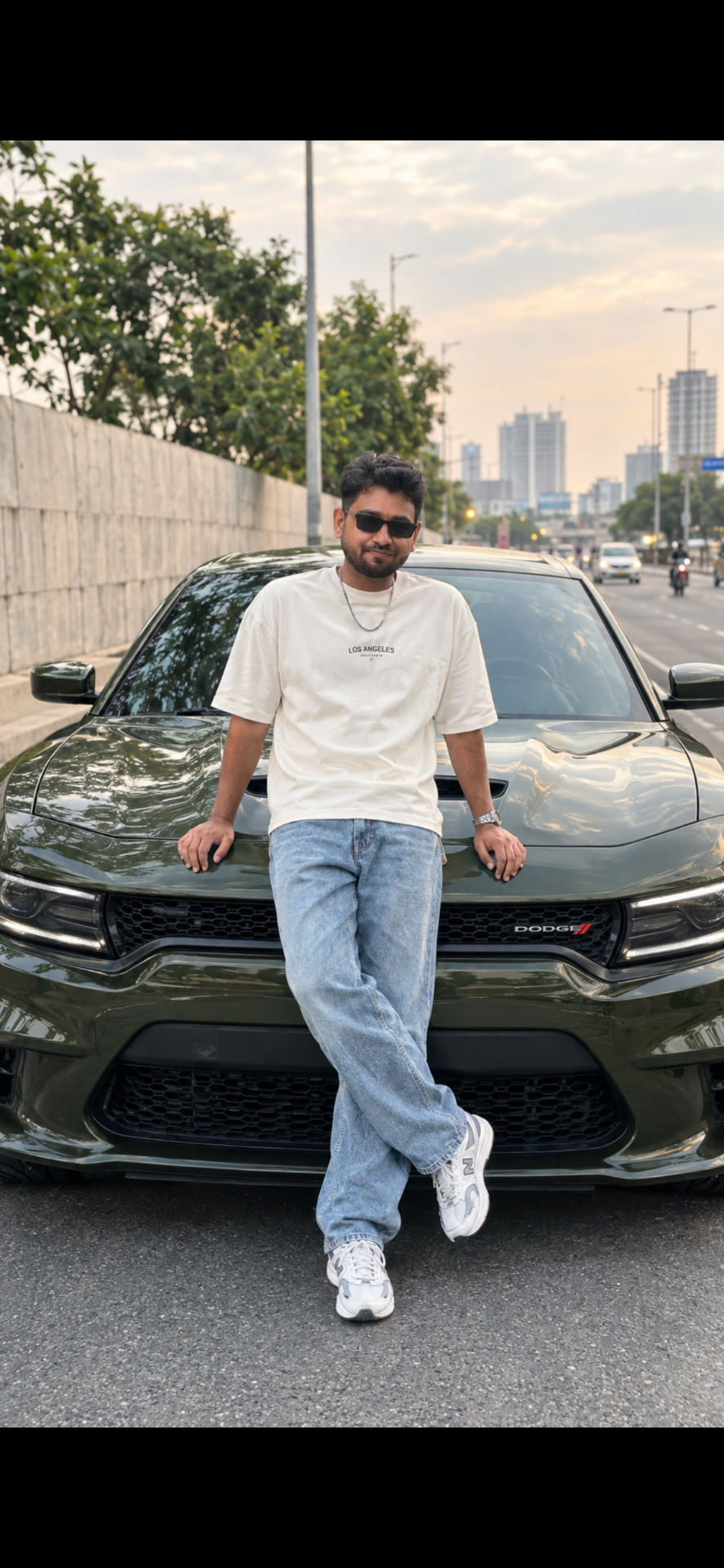 Create an ultra-realistic, high-quality 4K UHD full-body cinematic street-fashion photograph of a stylish young Indian man casually leaning
