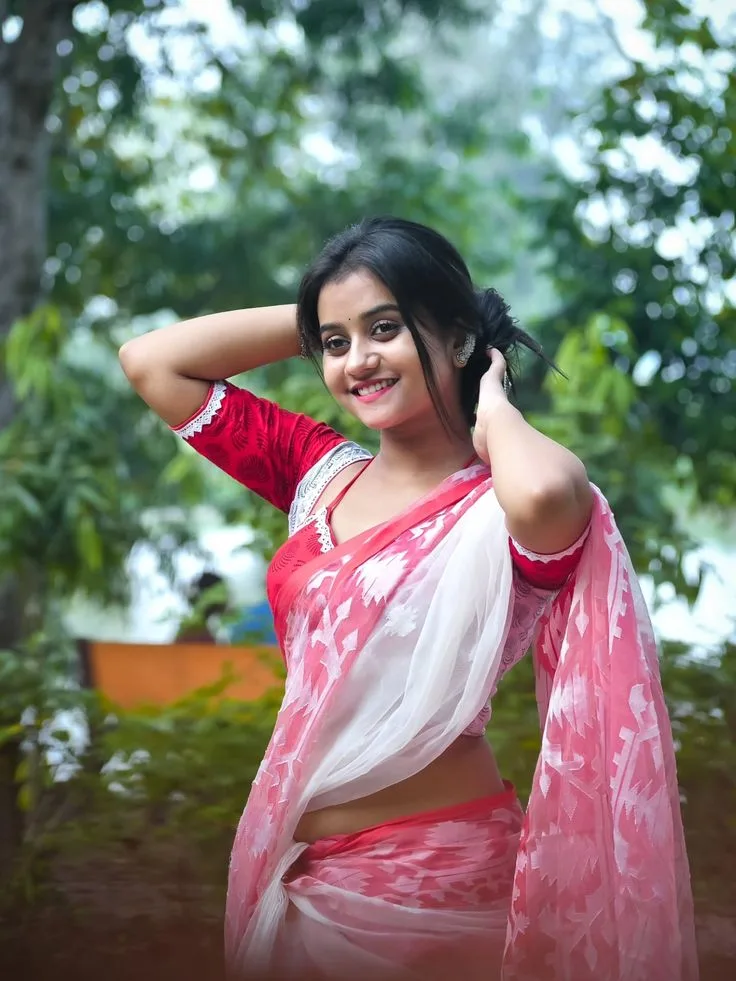 Candid Outdoor Portrait of Indian Woman in Traditional Red and White Saree