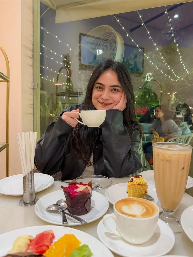 "style": "realistic cozy cafe lifestyle photography", "format": "vertical portrait", "aspect_ratio": "4:5", "camera": { "type": "smartphone