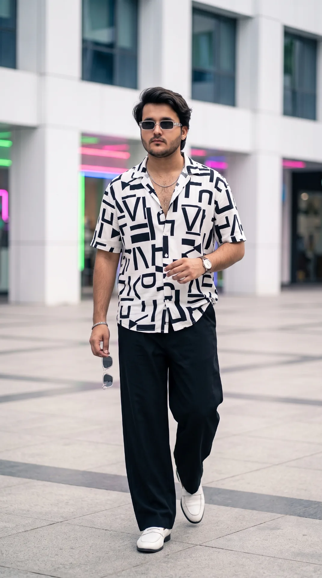 A full-body cinematic street fashion photograph of a stylish man (Use 100% same face as uploaded picture) walking Stylishly in a modern