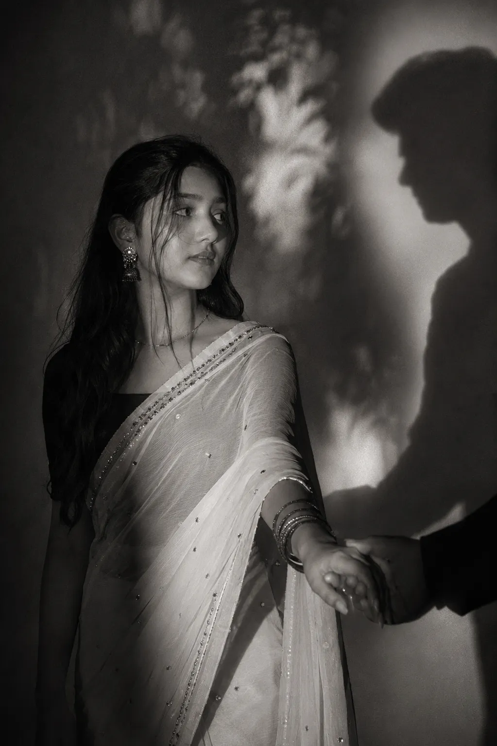 Prompt ↓ A cinematic, moody black and white editorial photograph of the girl in uploaded 1st picture with dark styled hair, long dark hair,