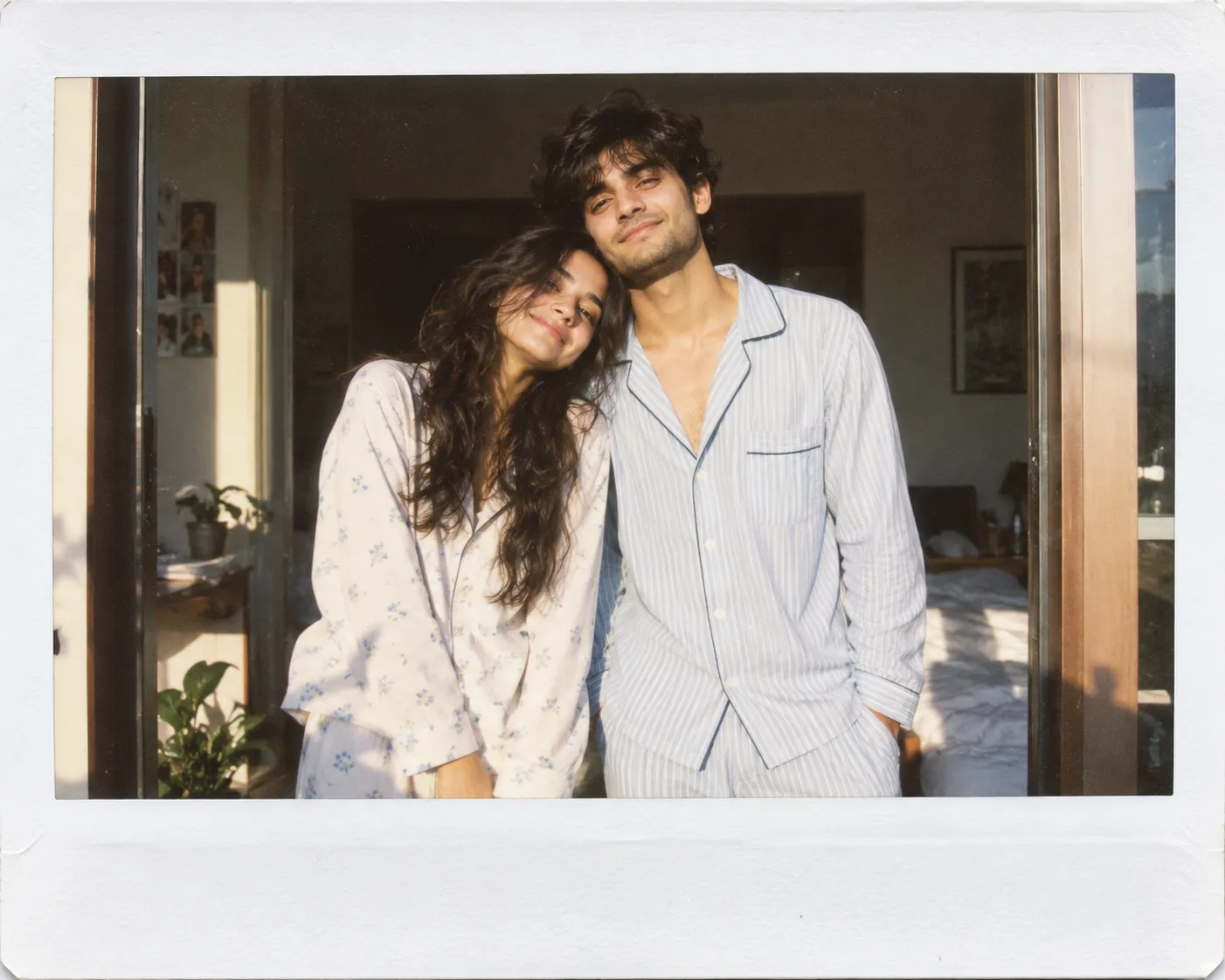 Candid Fuji Instax Mini instant photograph of a young couple standing in a sunlit doorway just after waking up, soft modern pastel colors,