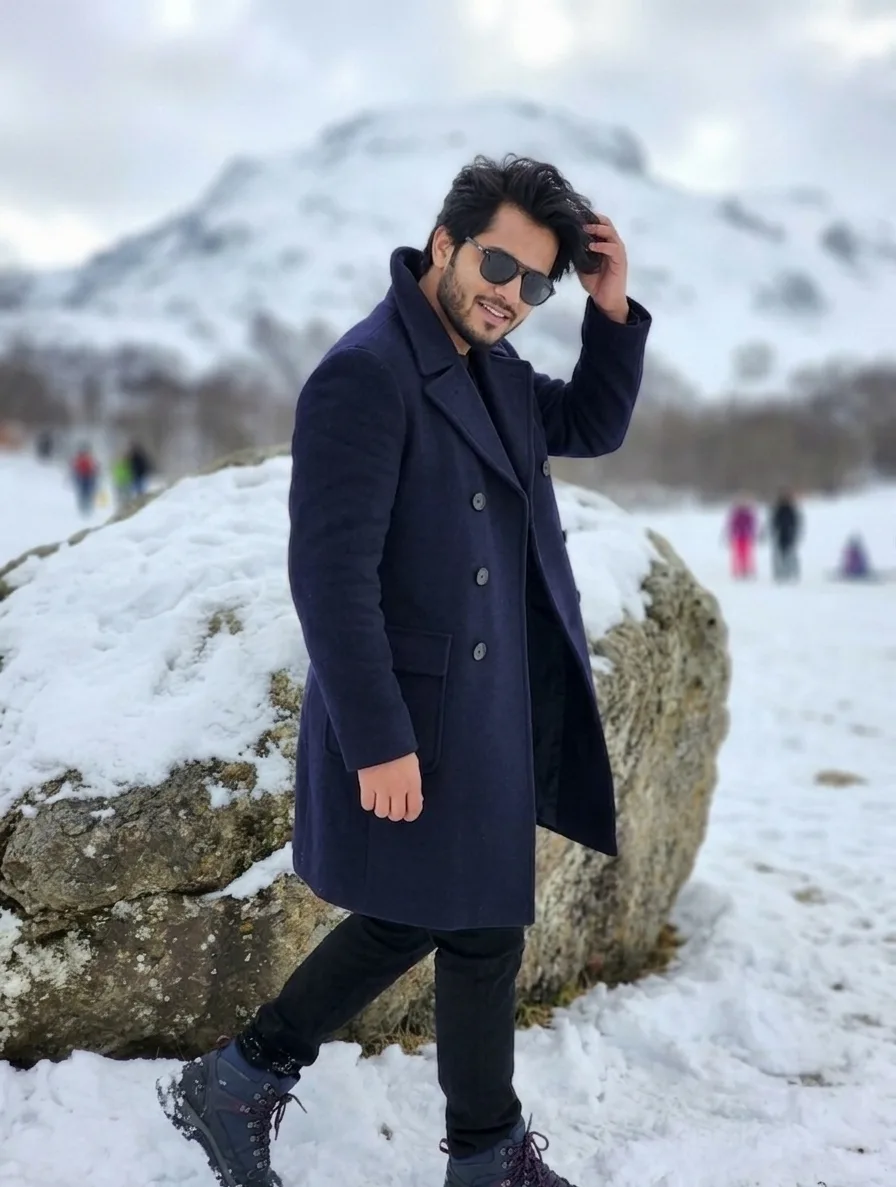 The Prompt: A high-quality lifestyle portrait of a stylish South Asian man with thick, wavy dark hair and a groomed beard.