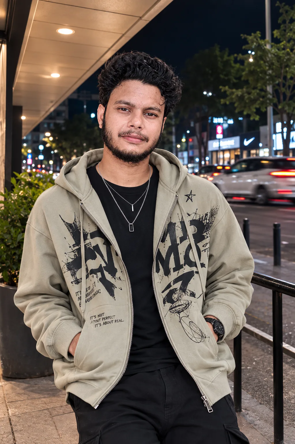 Create an ultra-realistic premium nighttime street-fashion portrait of a young male standing casually outdoors on a city street at night,