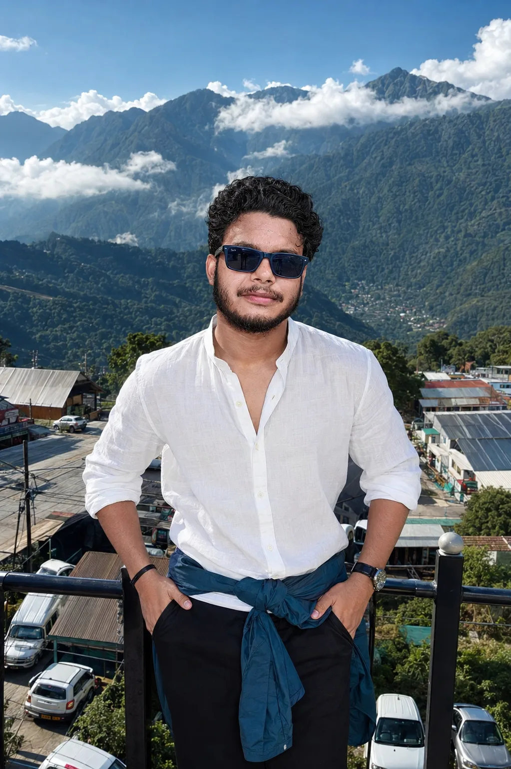 ultra-realistic, premium cinematic outdoor fashion portrait** of a stylish young male traveler standing confidently at a scenic elevated