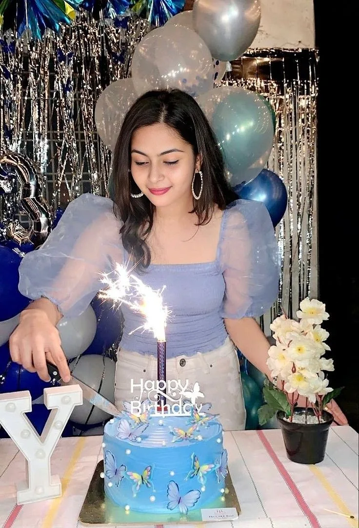 Create an ultra-realistic cinematic vertical birthday portrait of a young woman celebrating her birthday at a beautifully decorated party