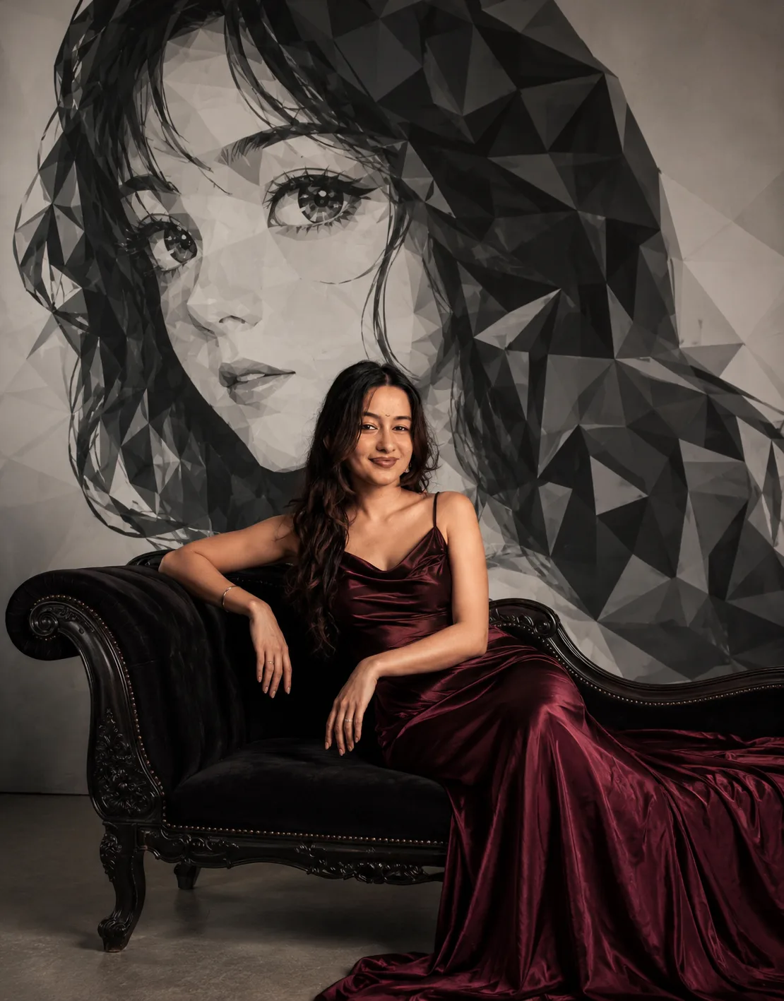 Elegant luxury fashion editorial portrait, beautiful woman seated gracefully on a vintage black velvet chaise lounge, wearing a deep