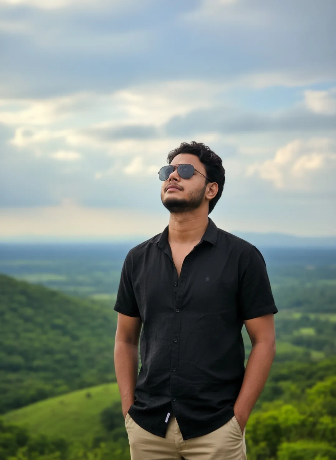 A photorealistic, high-resolution portrait of a 26-year-old Indian man, 5 feet 5 inches tall, with a medium-fair skin tone, dark curly