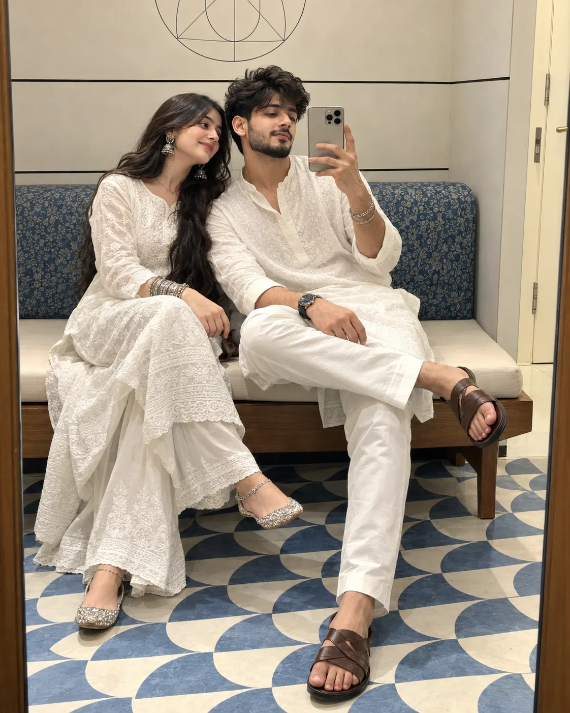 A hyper-realistic, 100% photorealistic mirror selfie of a young Indian couple sitting close together on a wooden bench indoors.