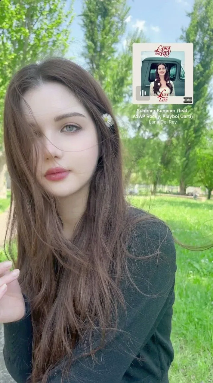 Create a soft, dreamy, ultra-realistic outdoor portrait of a young woman standing in a lush green park during a bright summer day.