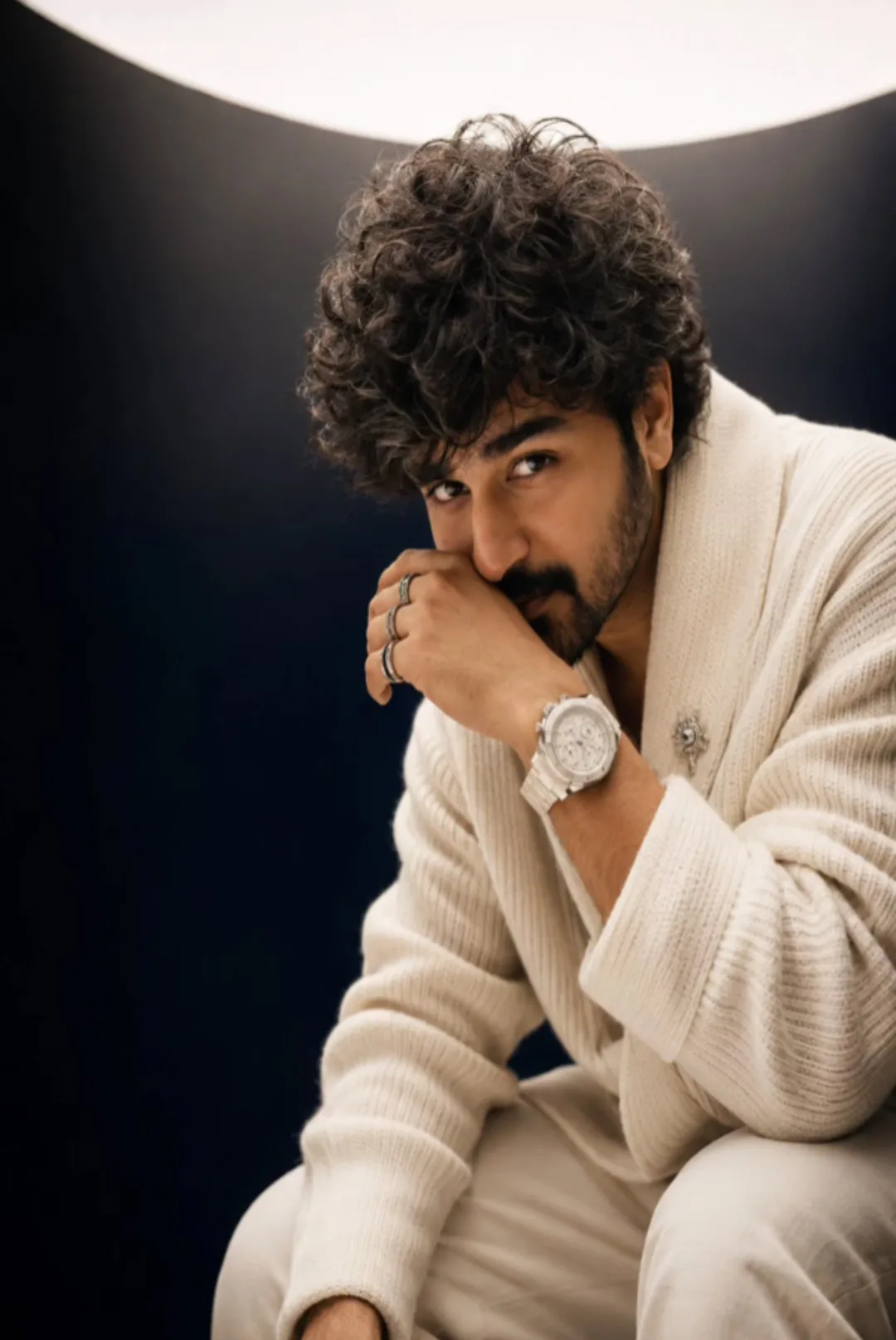 Create an ultra-realistic cinematic luxury fashion editorial portrait of a handsome South Indian man in his late thirties, photographed in