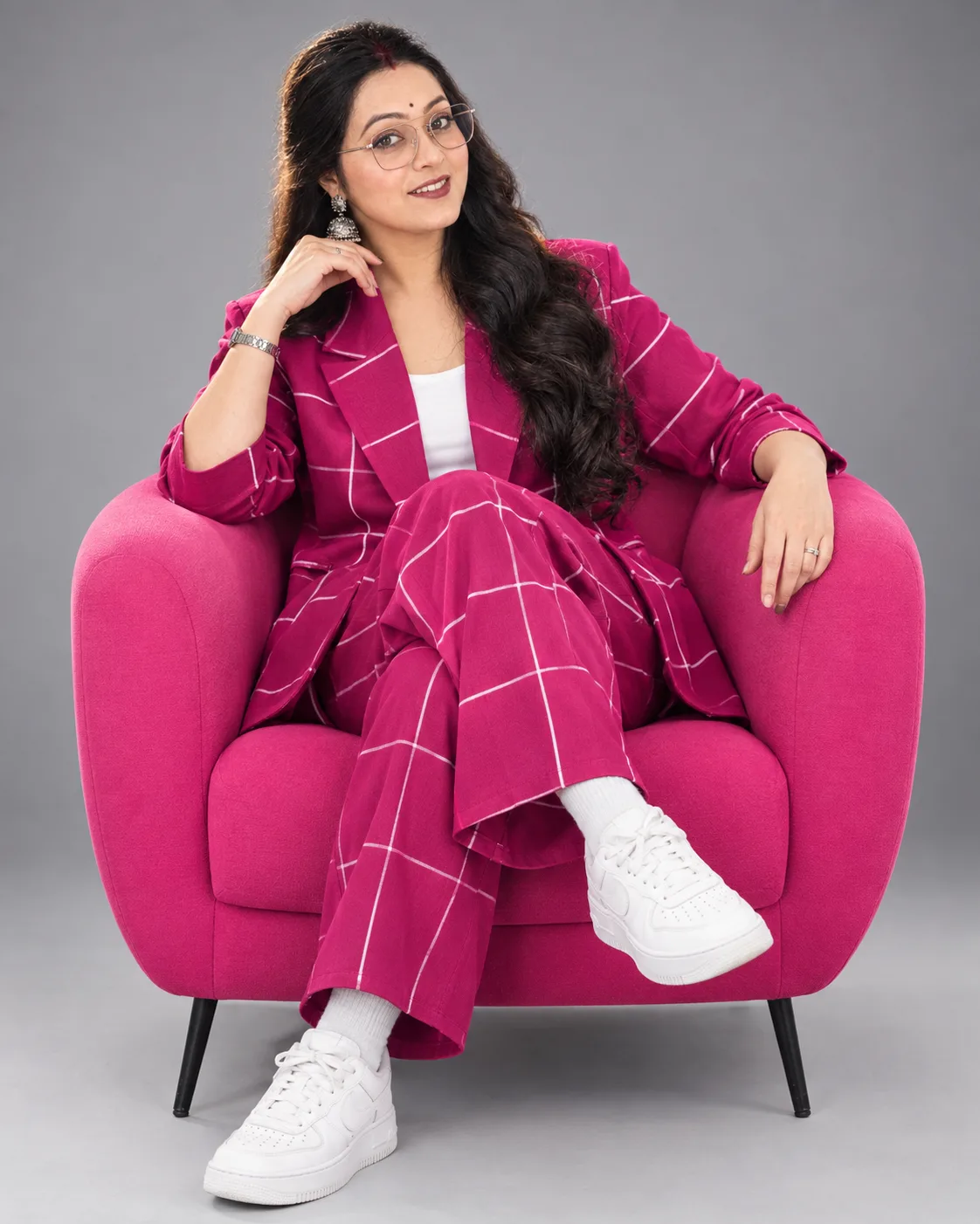 Striking and modern advertisement features an attractive and elegant woman (use the uploaded image as a reference for the face) wearing