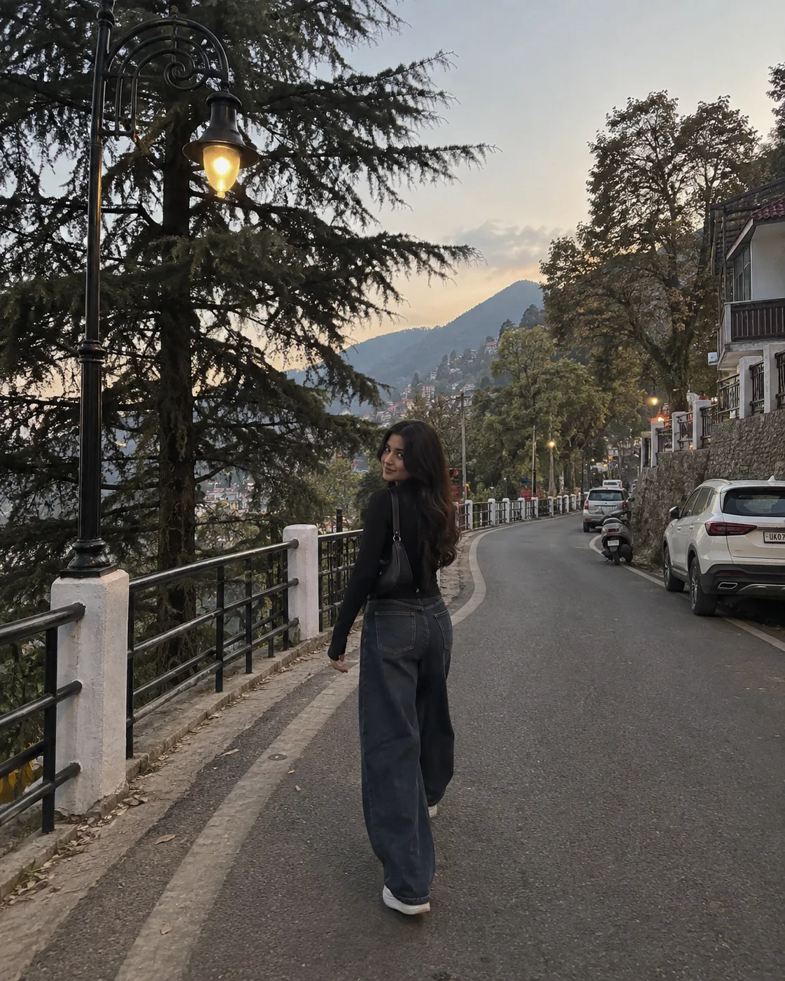 Use the uploaded street photograph with the decorative black street lamp, large trees and winding road as the ABSOLUTE LOCATION REFERENCE