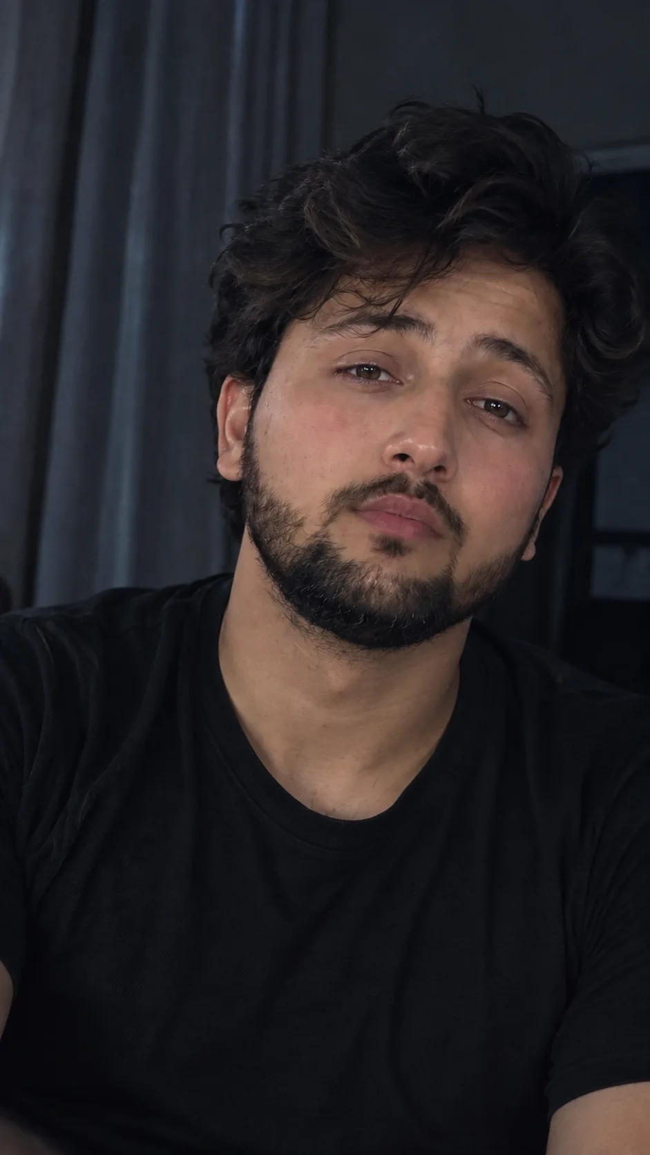 Create a highly realistic close-up portrait of a young Indian man, matching the reference image exactly in facial structure, facial