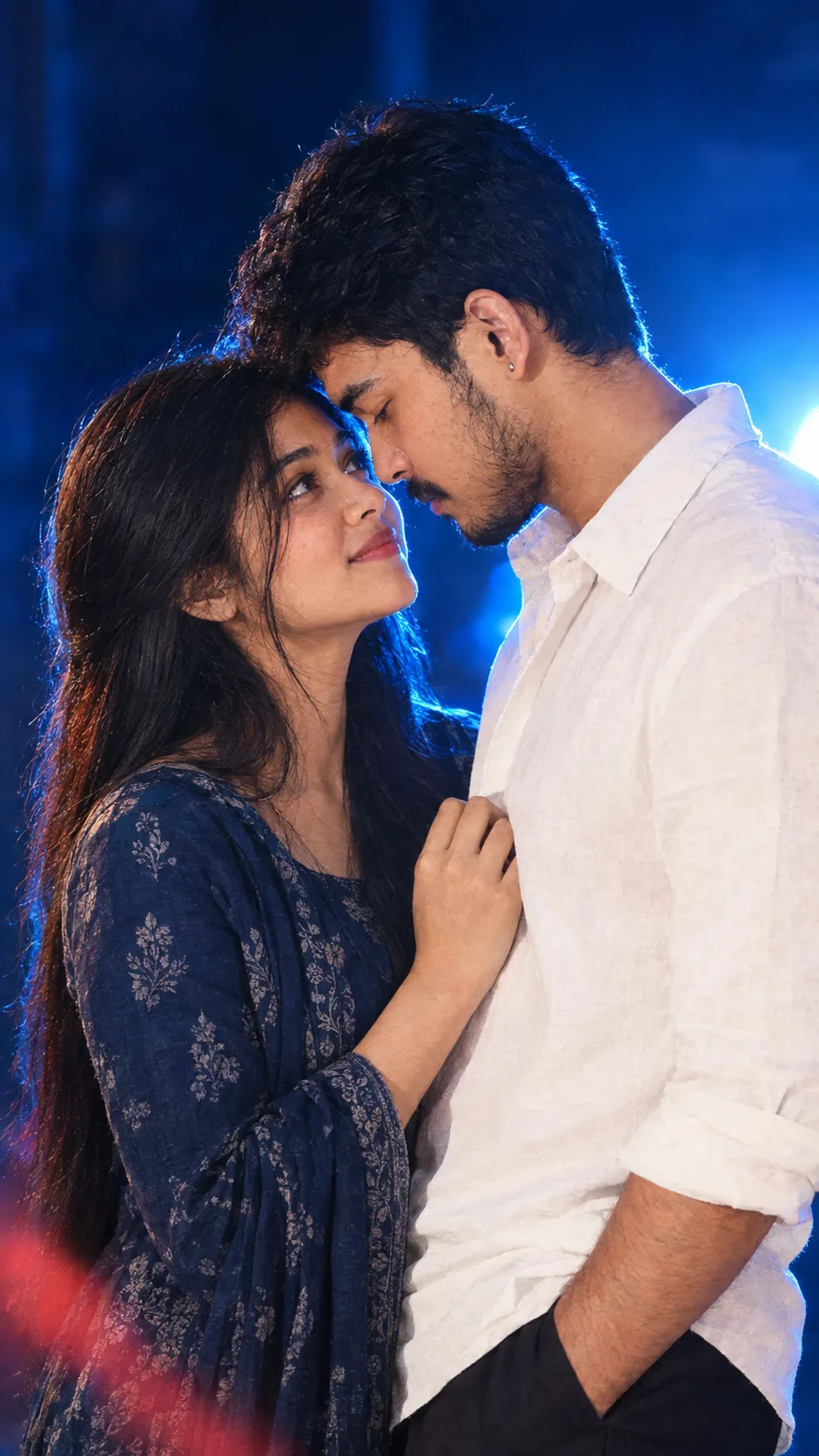 Create an ultra-realistic cinematic 8K vertical 9:16 portrait of a young South Indian couple standing very close together in an intimate,
