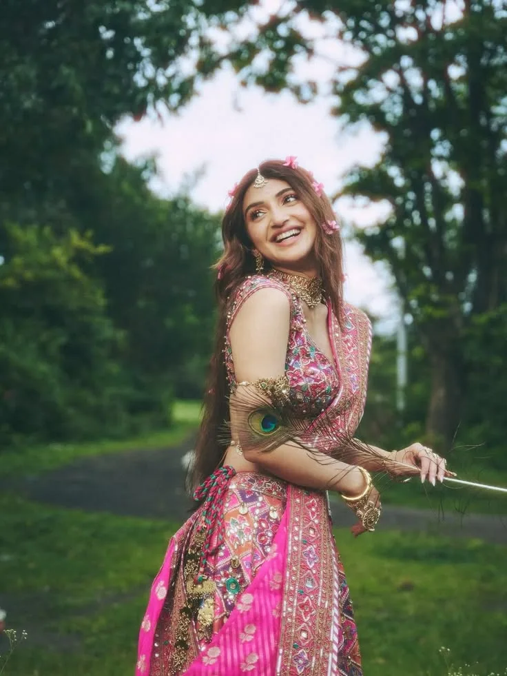 A photorealistic vertical portrait of South Indian actress Sreeleela in a traditional Radha-inspired aesthetic, faithfully preserving her