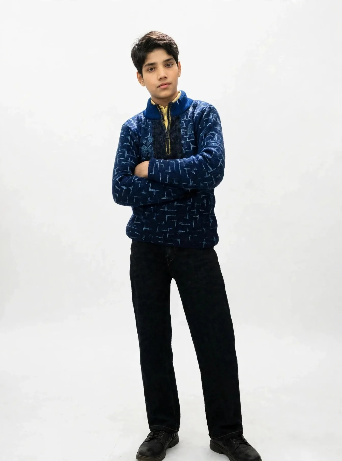 A stylish boy standing in front of the iconic Burj Khalifa, professional photo, realistic lighting, 8k quality