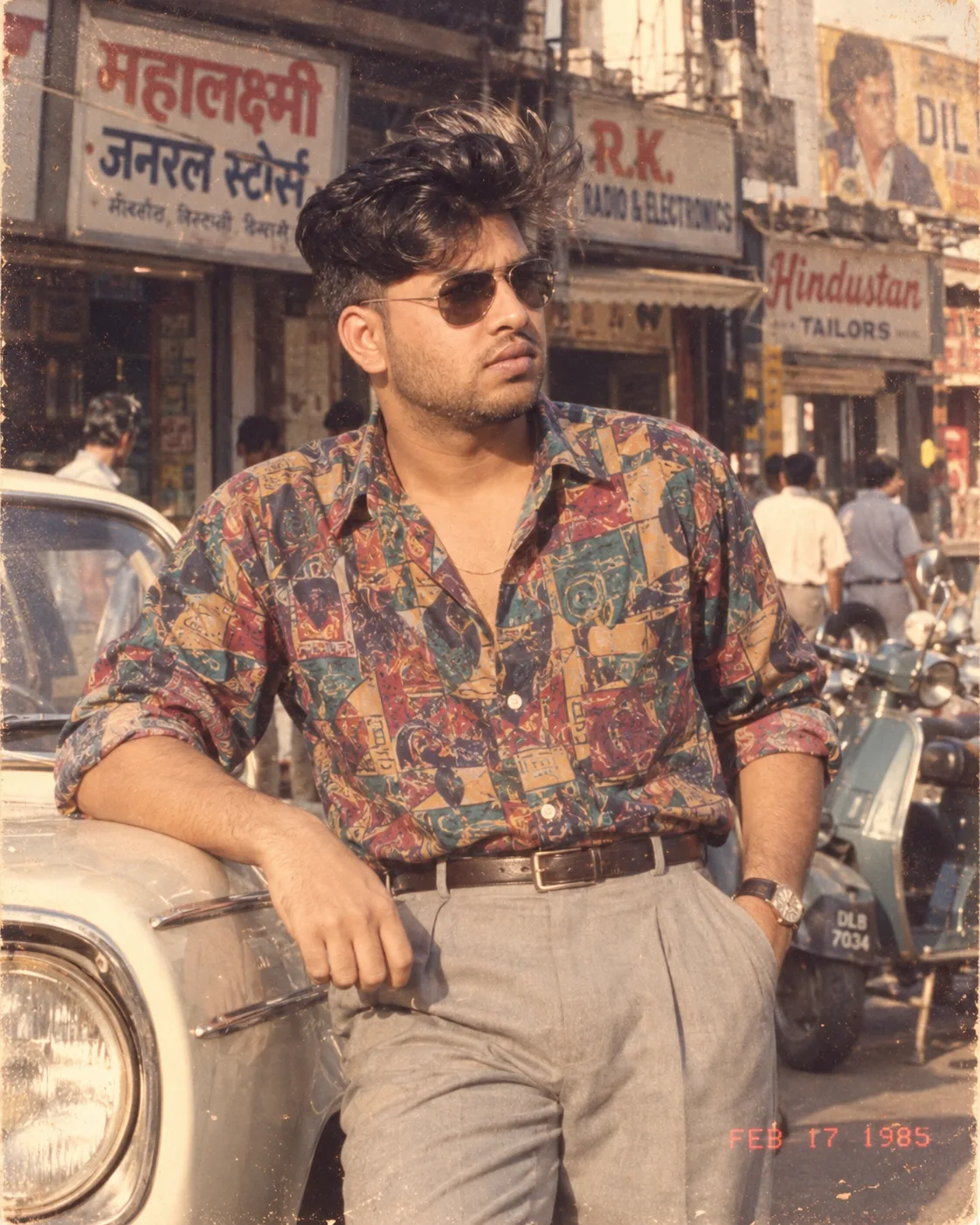 Using my uploaded photo as the primary identity reference, show me as a stylish young man photographed on an Indian city street around