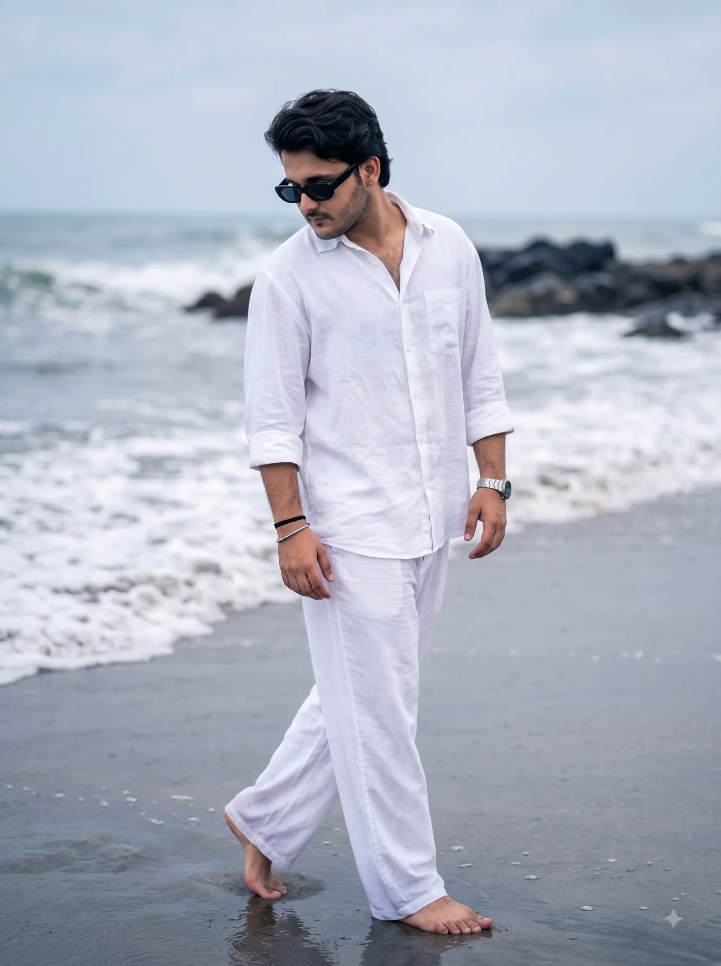 Photorealistic full-body side profile photo of a young Indian man age 26 with stylish black hair and a light beard, wearing black