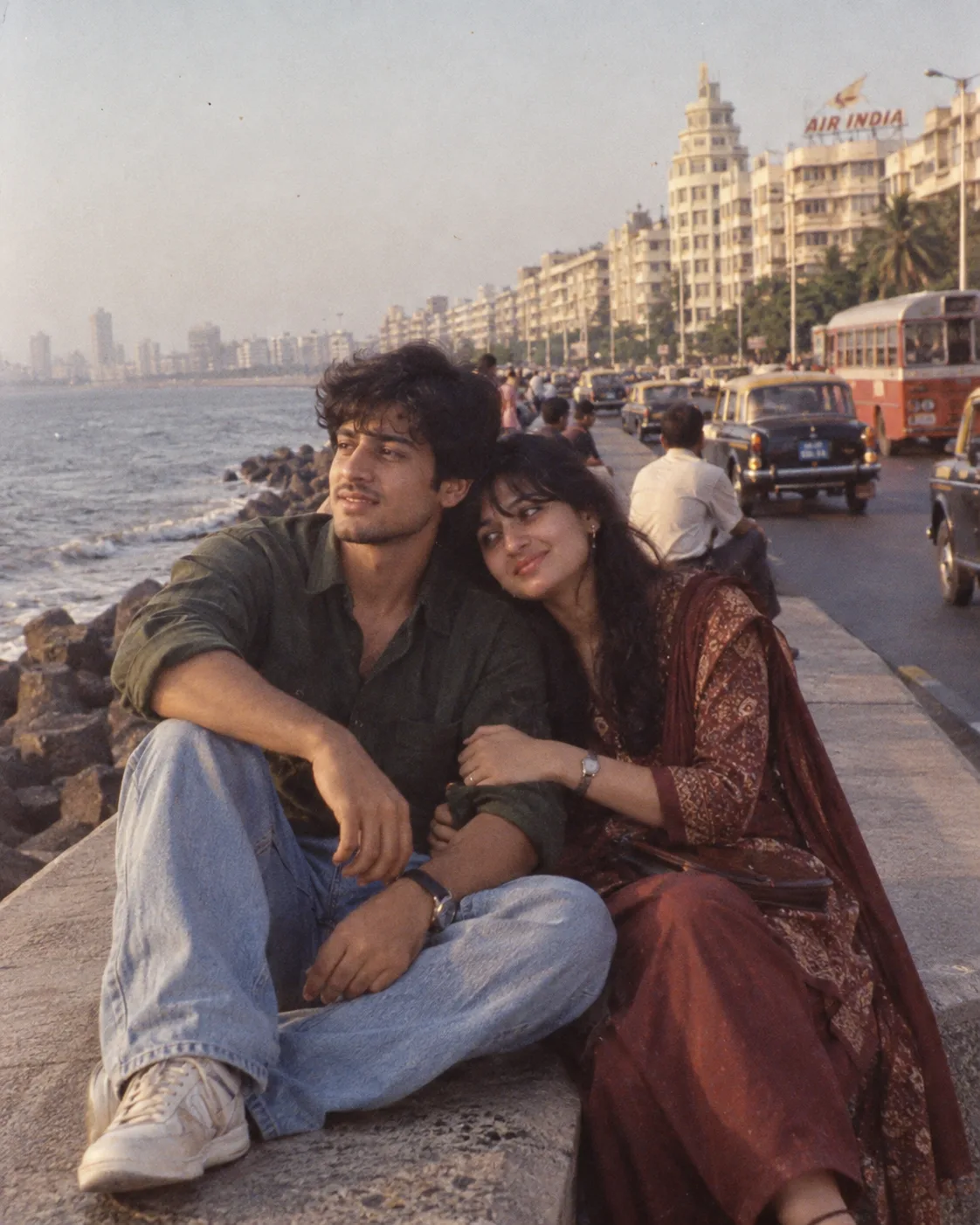 AUTHENTIC 1990s MUMBAI COUPLE PHOTOGRAPH - MARINE DRIVE: 4:5 vertical portrait of the same Indian couple sitting naturally together on the