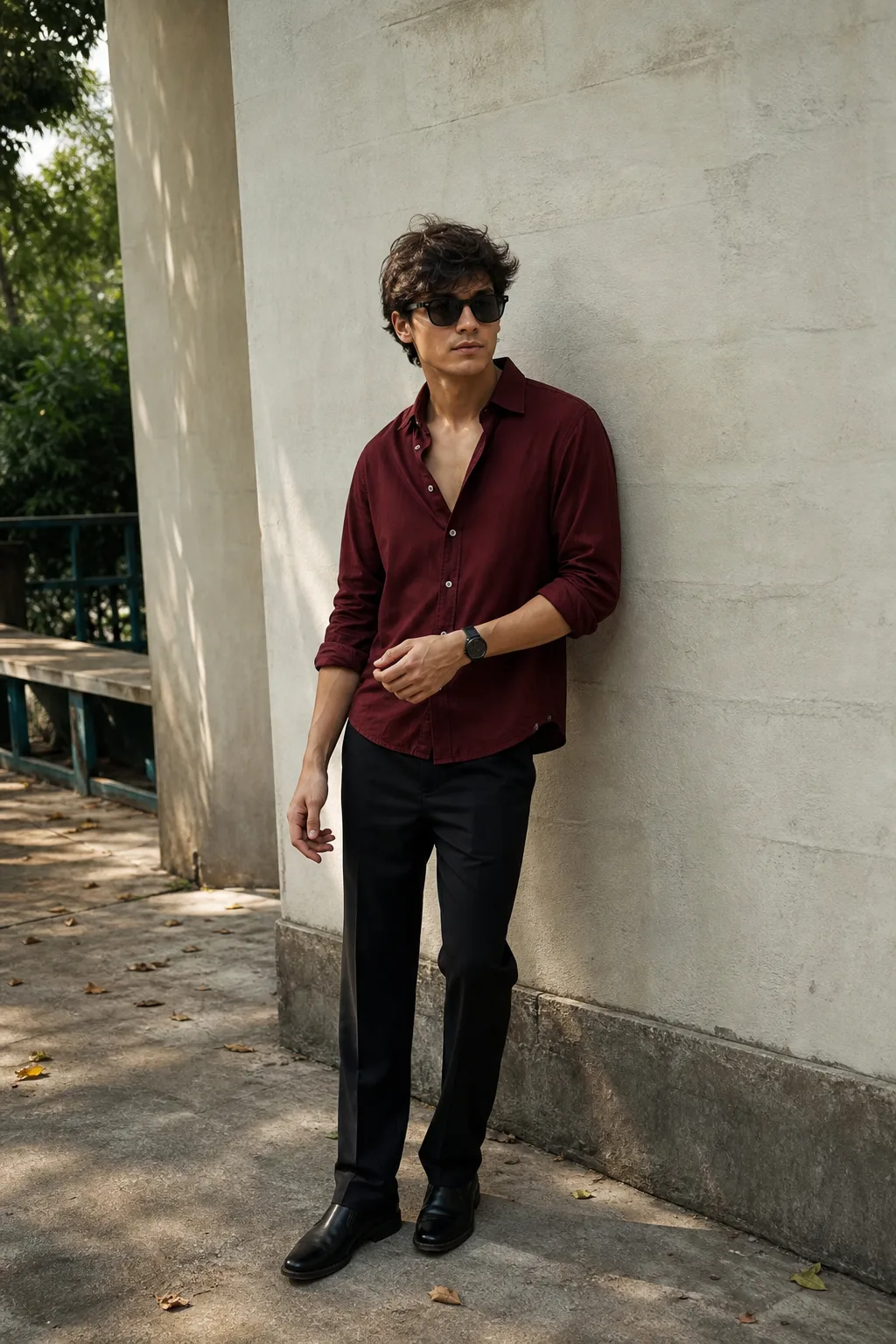 Create a premium ultra-realistic full-body fashion portrait of a stylish young adult man standing casually beside a textured exterior wall