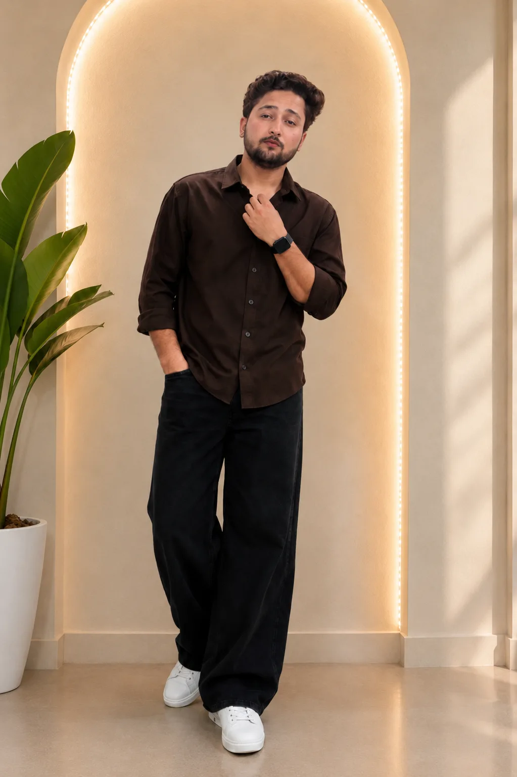 Create a highly realistic full-body lifestyle portrait of a young Indian man standing casually indoors.