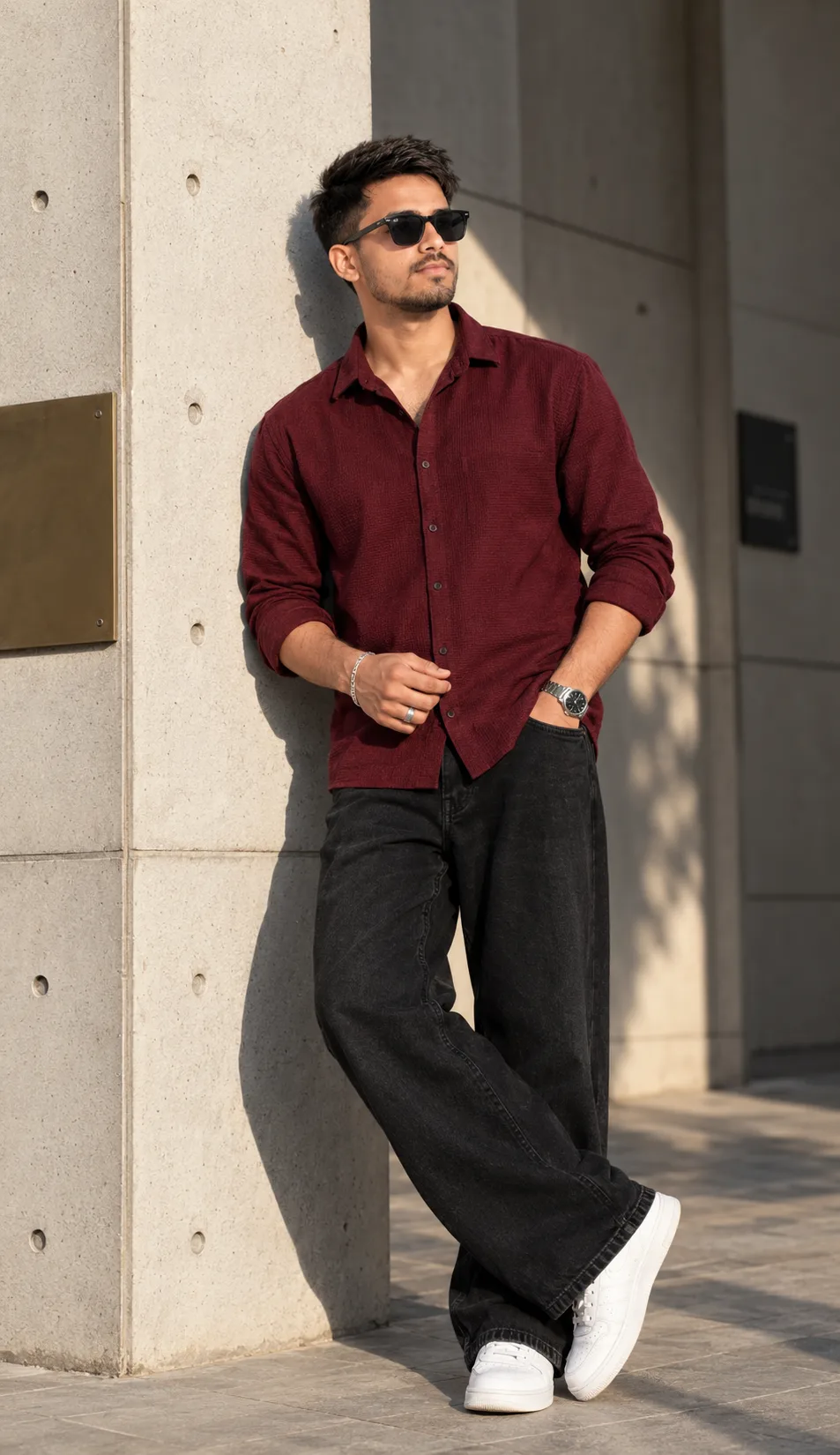 Create a highly realistic full-body fashion portrait of a stylish young South Asian/Indian man standing confidently outdoors against a