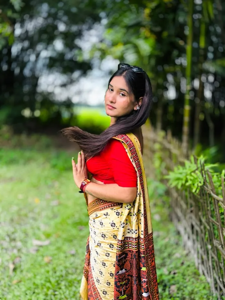 A photorealistic vertical medium-three-quarter portrait in exact 3:4 aspect ratio capturing the young South Asian woman from the reference
