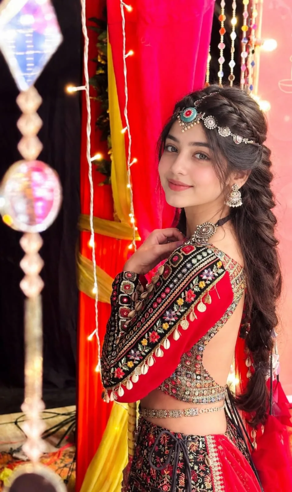 Create an ultra-realistic, high-detail vertical portrait photograph (9:16) of a young South Asian woman at a colorful festive celebration.