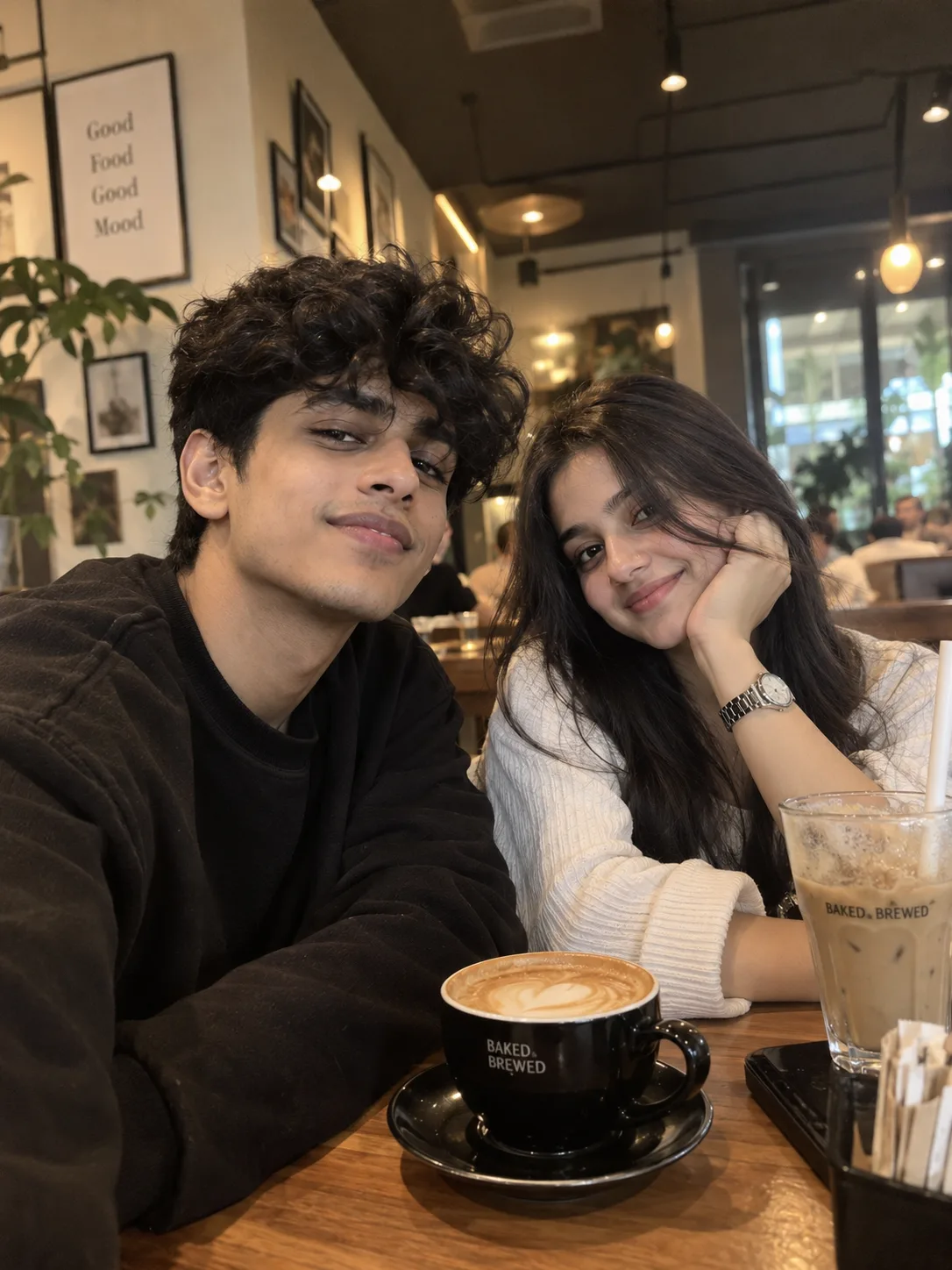 Prompt: A photorealistic couple portrait captured inside a cozy, modern cafe with warm indoor lighting.