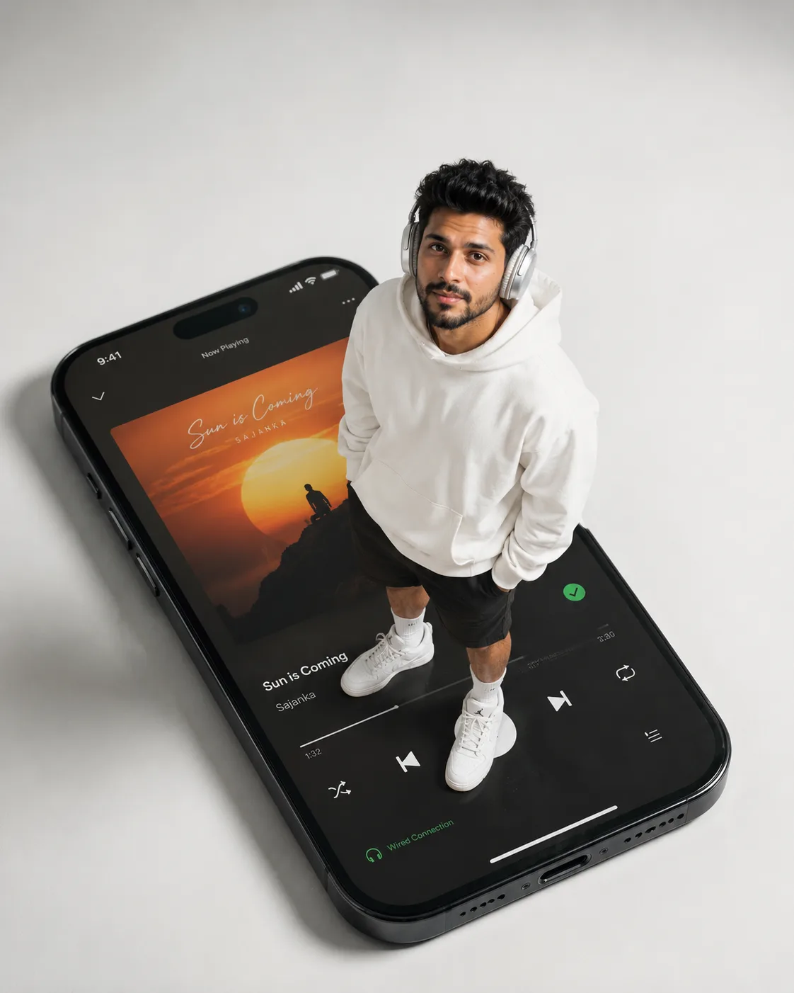 Create a sleek, modern forced-perspective portrait of a male standing on top of a gigantic smartphone screen, with extreme scale contrast.