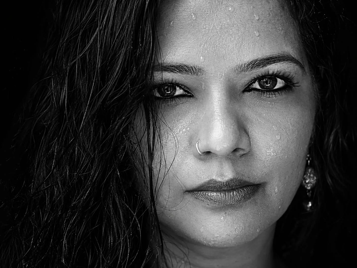 Create a black and white, extreme close-up, photorealistic, 8K ultra-detailed, DSLR macro portrait.