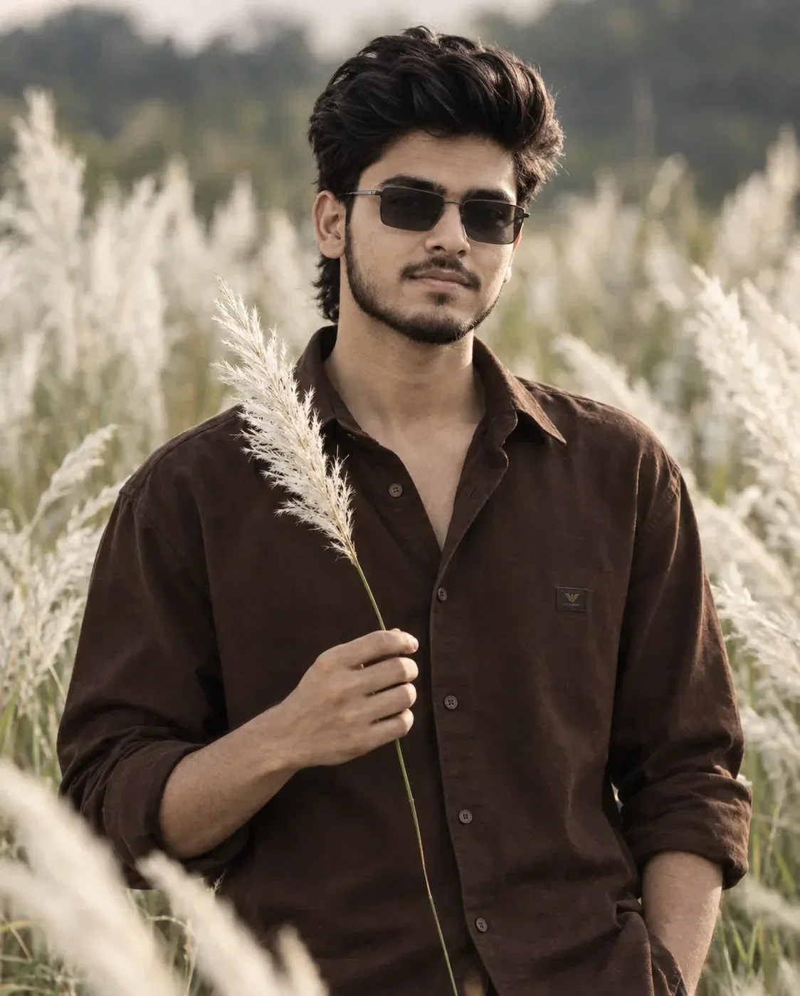 Ultra-realistic cinematic half-body portrait of a South Asian boy in his 18 year old slim body standing in a middle of lush white Kans