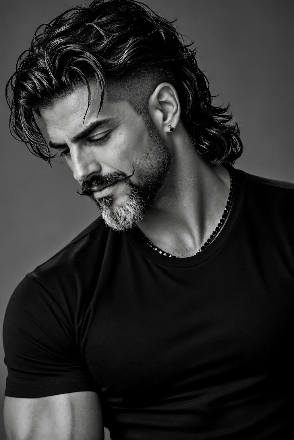 Ultra-realistic black-and-white portrait of a masculine adult male model in a dramatic three-quarter side profile, looking downward with a