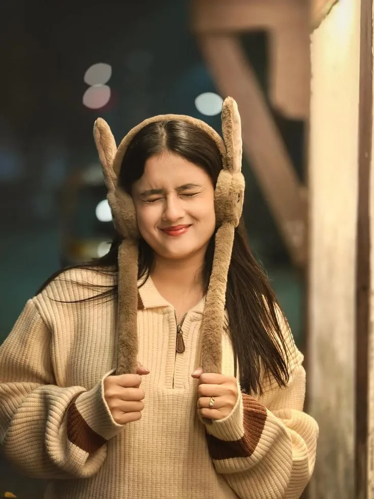 Playful Winter Portrait of Young Indian Woman in Bunny Earmuffs