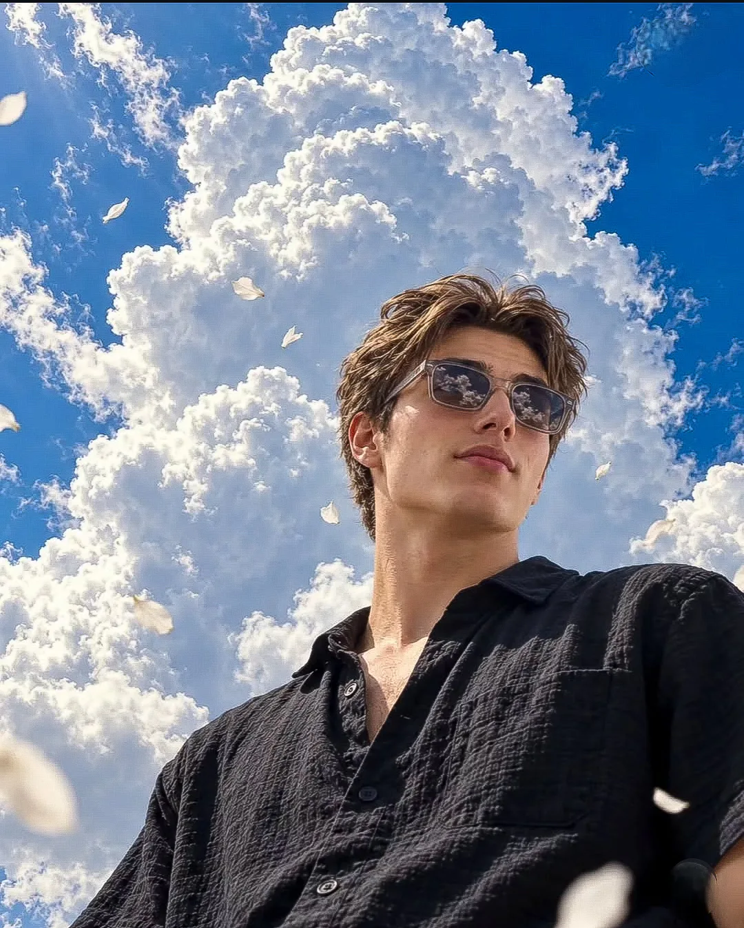 Create an ultra-realistic cinematic low-angle portrait using the uploaded photo only as the strict facial identity reference.