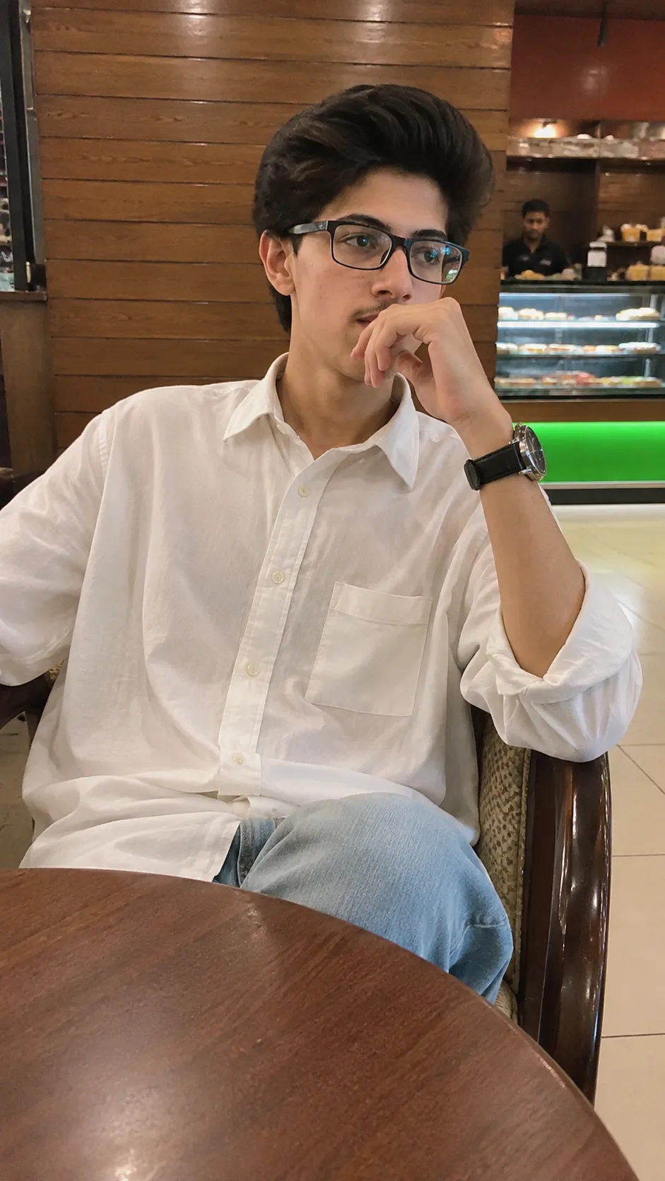 Create a highly realistic, photorealistic vertical 9:16 smartphone photograph of the person from the provided personal reference image,