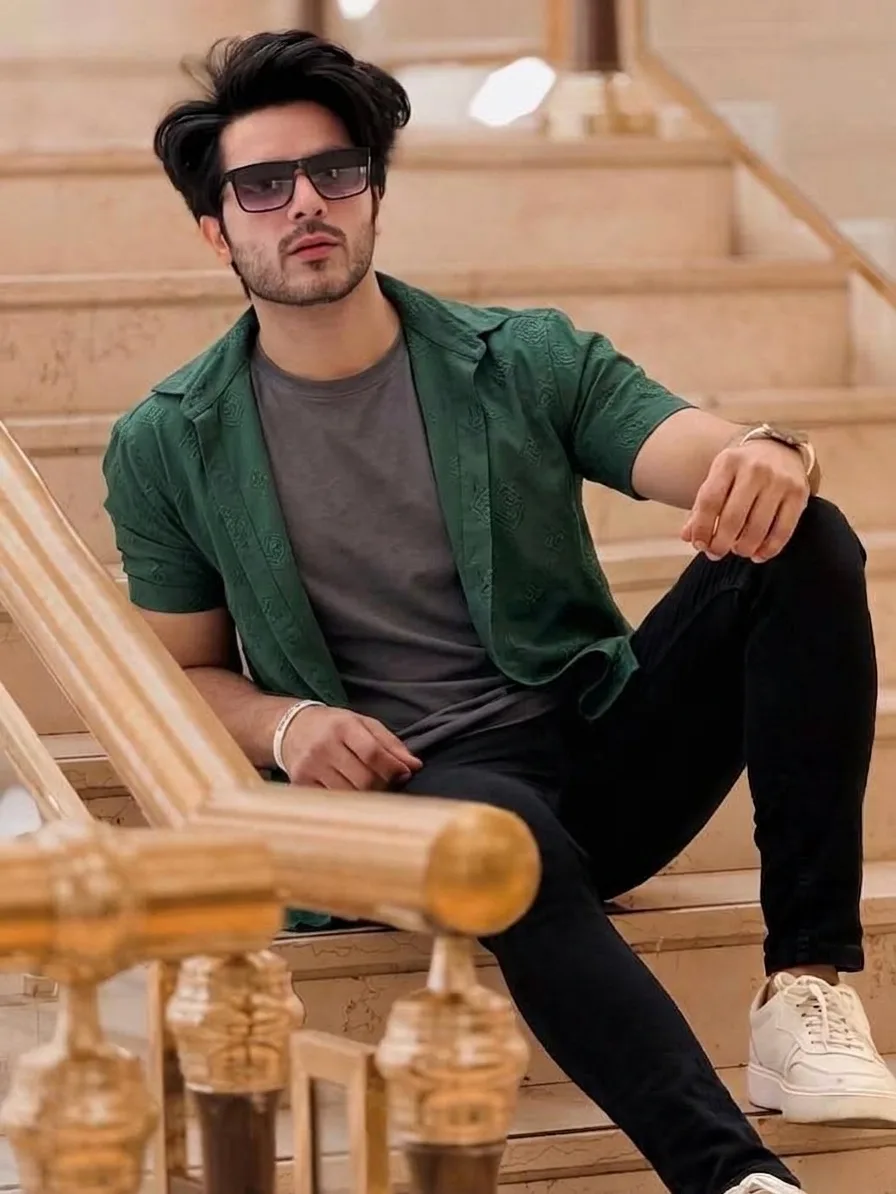 **Title:** Golden Hour Portrait | Smart-Casual Male Model on Staircase --- **Prompt:** > A striking professional photograph capturing a