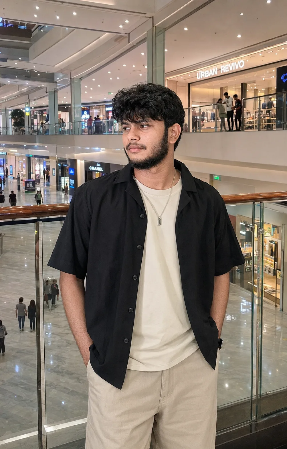 Create an ultra-realistic, premium vertical lifestyle fashion photograph of a young adult male standing inside a large modern luxury