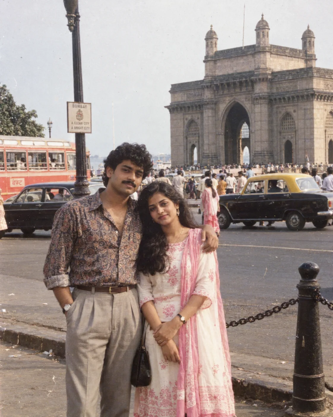 AUTHENTIC 1980s MUMBAI COUPLE PHOTOGRAPH - GATEWAY OF INDIA: 4:5 vertical portrait of a genuinely photographed Indian couple standing