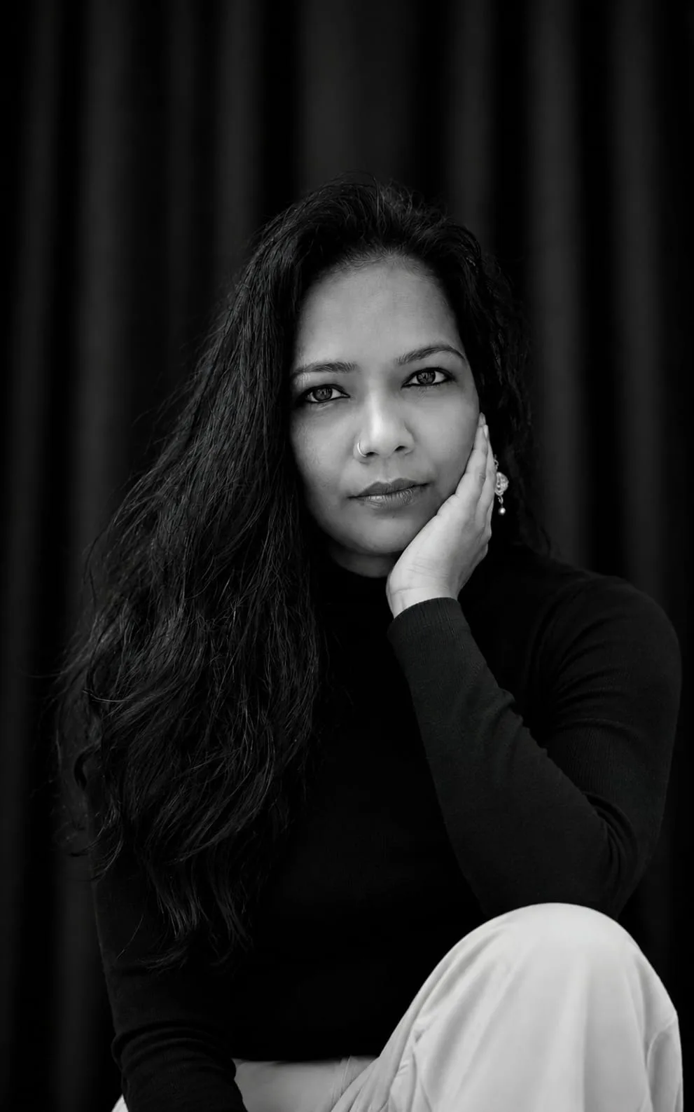 Create a black and white, photorealistic, 8K ultra-detailed, DSLR portrait.