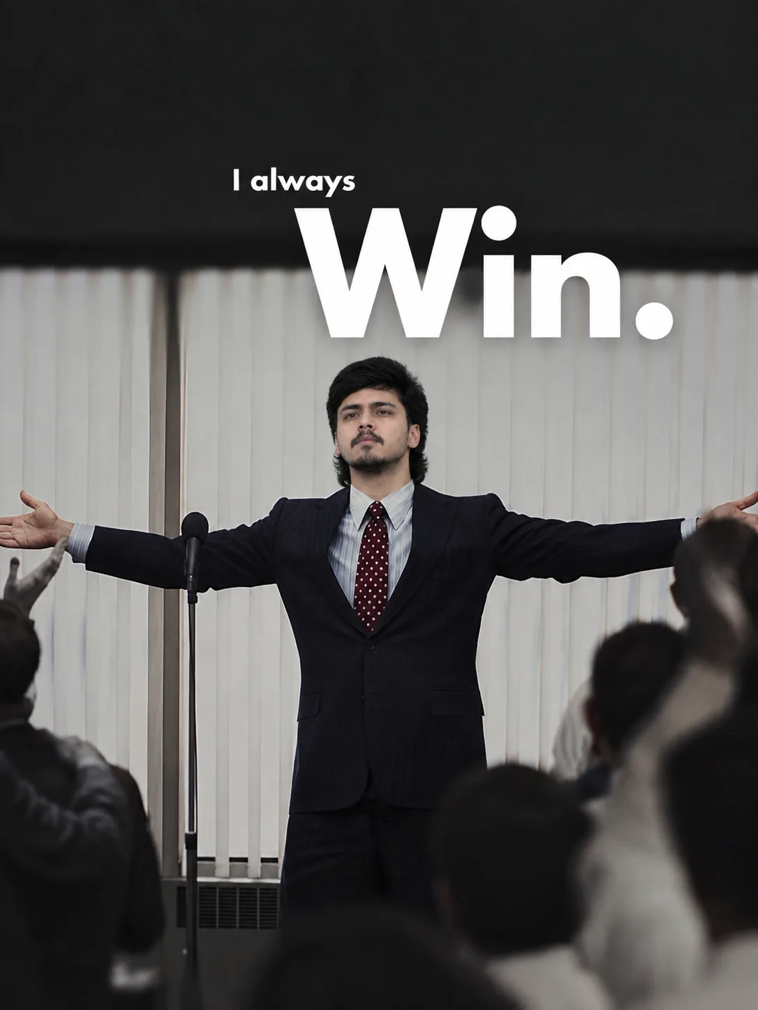 Create a photorealistic cinematic vertical portrait of a confident young Indian man standing on a stage in front of an audience, delivering