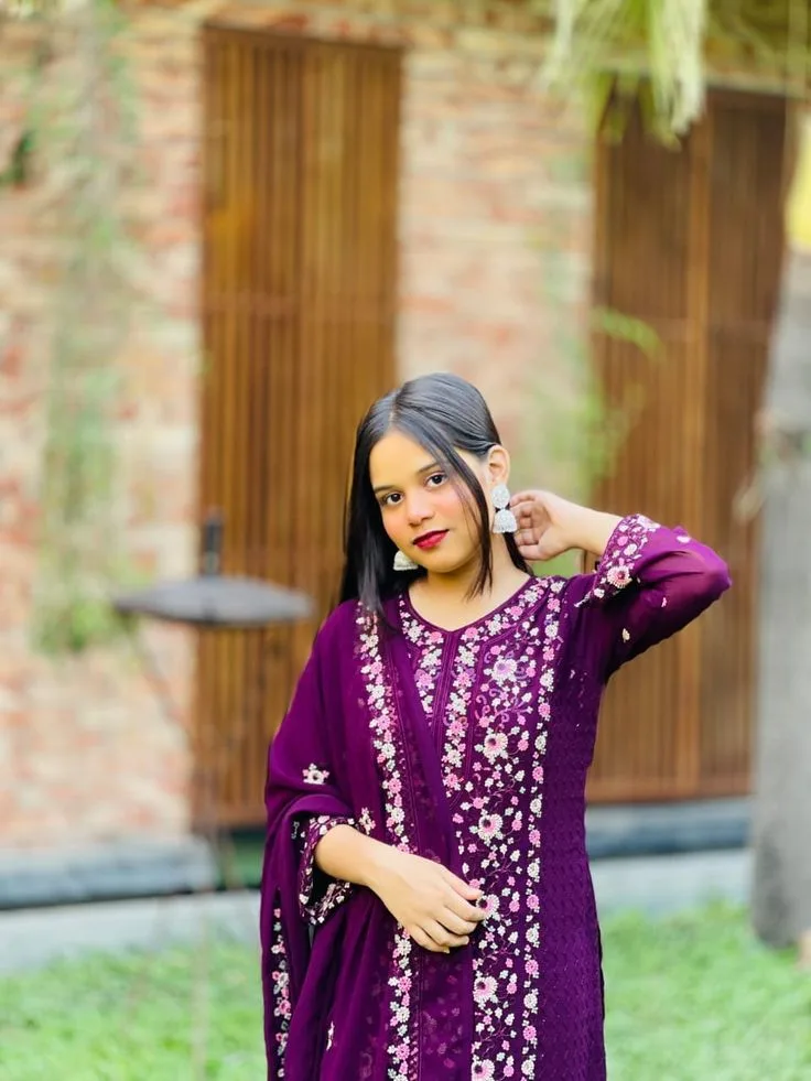 A photorealistic vertical medium shot of the young South Asian woman from the reference image, faithfully preserving her recognizable