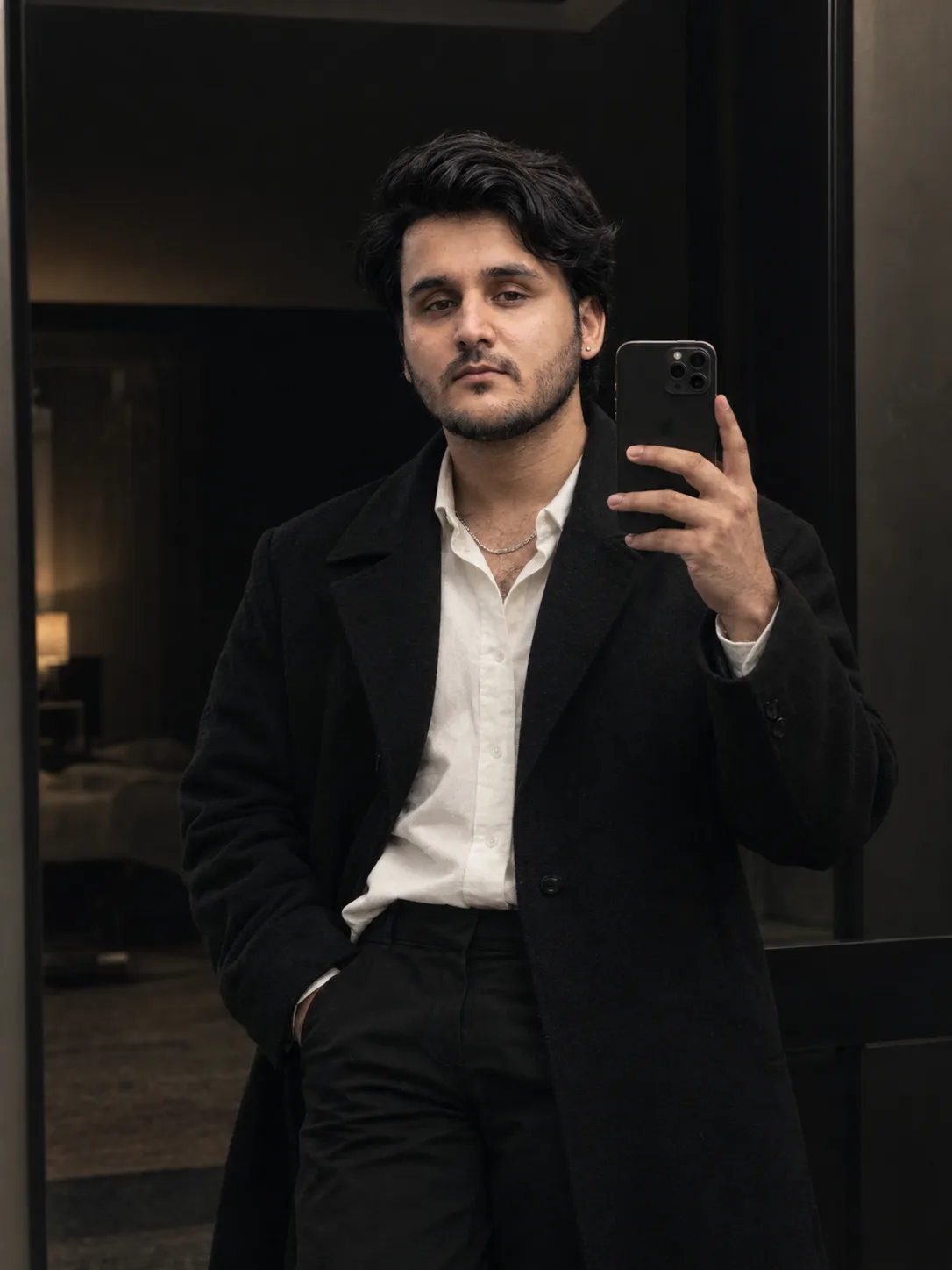 4K ultra realistic dark aesthetic mirror portrait of a confident young man standing in front of a minimalist black-framed mirror.