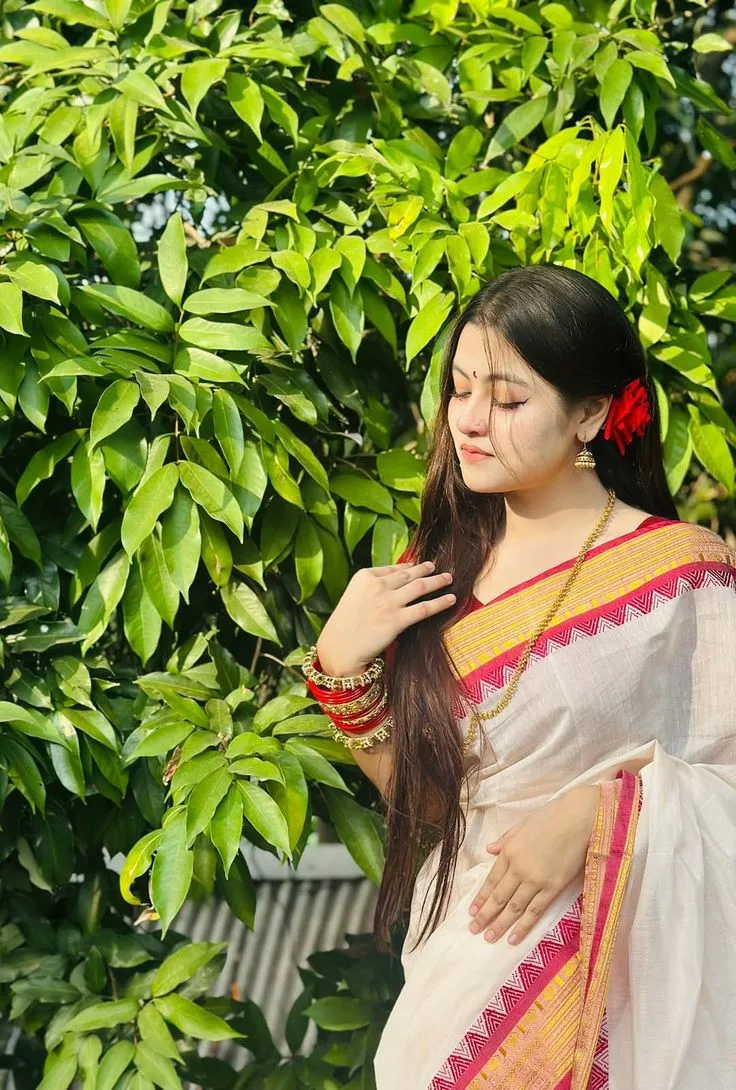 Create a soft, natural, photorealistic Indian traditional portrait inspired by the uploaded reference image.