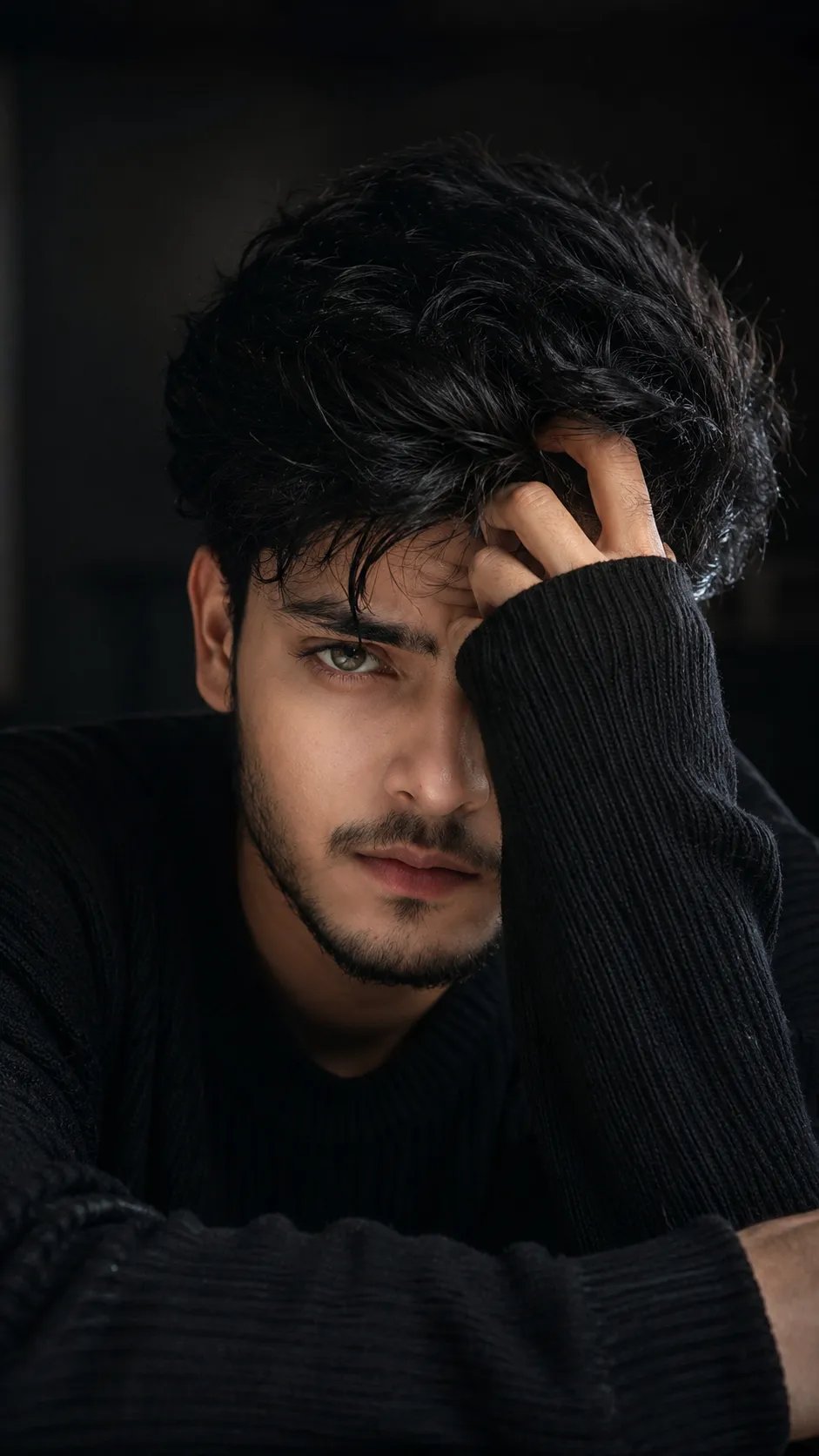 Ultra-realistic cinematic close-up fashion portrait of a young South Asian man with a sharp defined jawline, smooth warm fair-medium skin