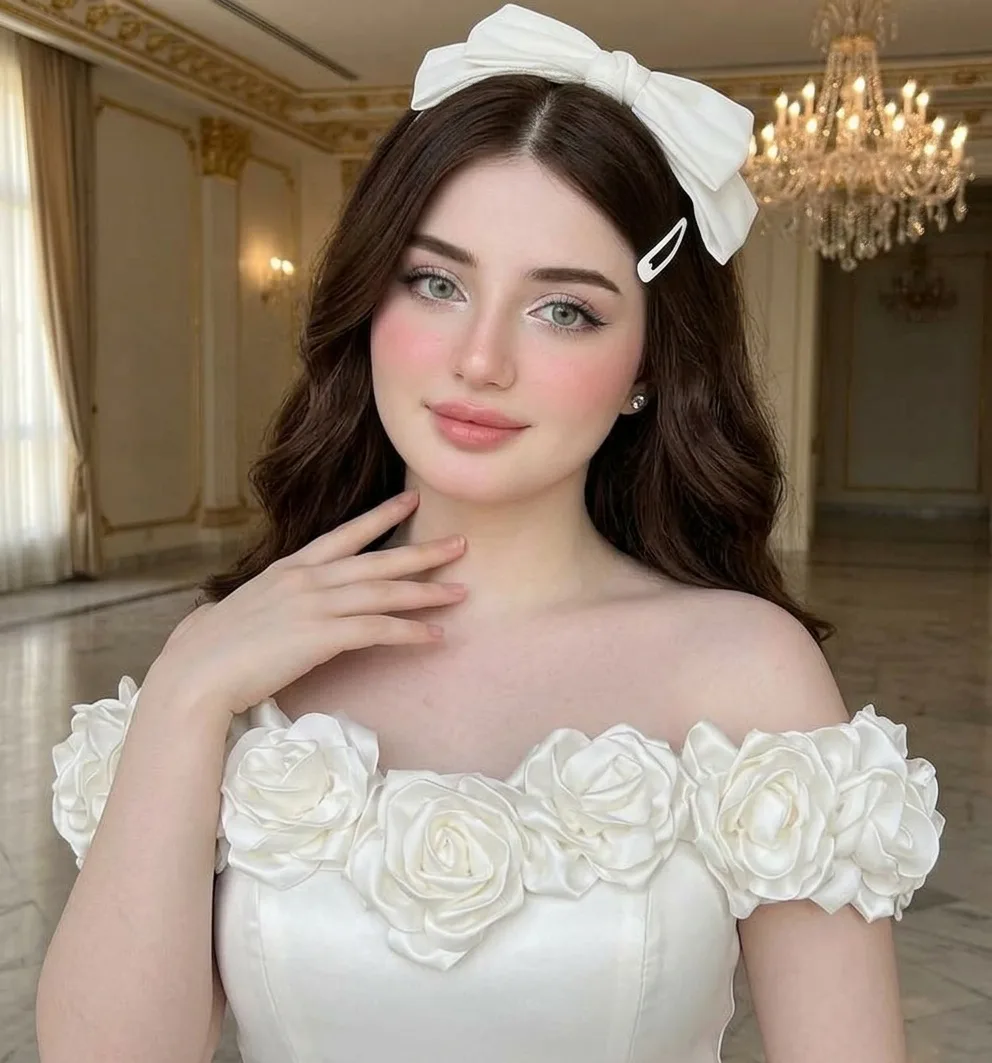 > A full-body, high-resolution photograph of the young woman seen in `image_69.png`, maintaining her identical features, hair style,