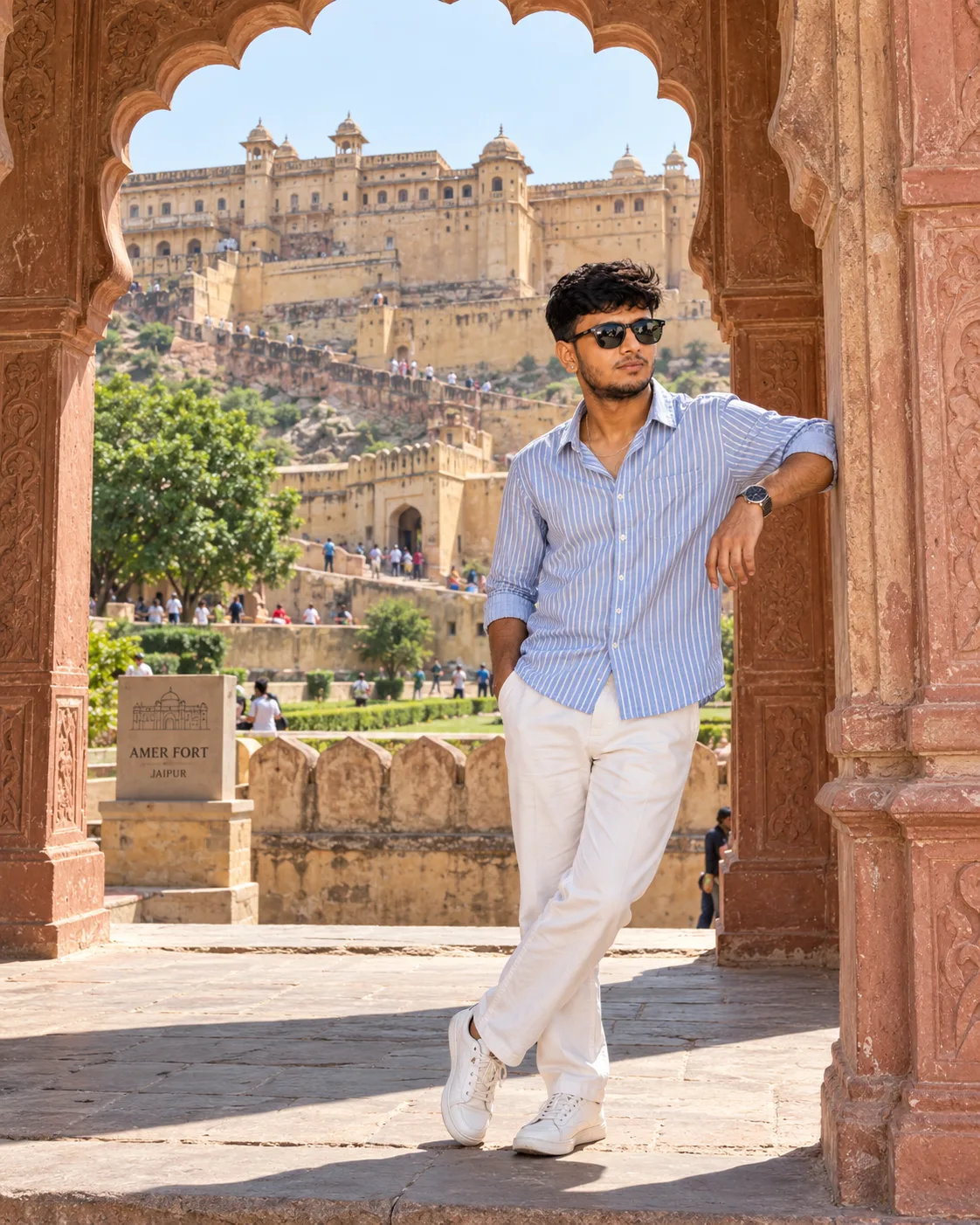 📸 Prompt: Create a highly realistic, ultra-detailed cinematic travel photograph of a young Indian man casually posing at Amer Fort (Amber