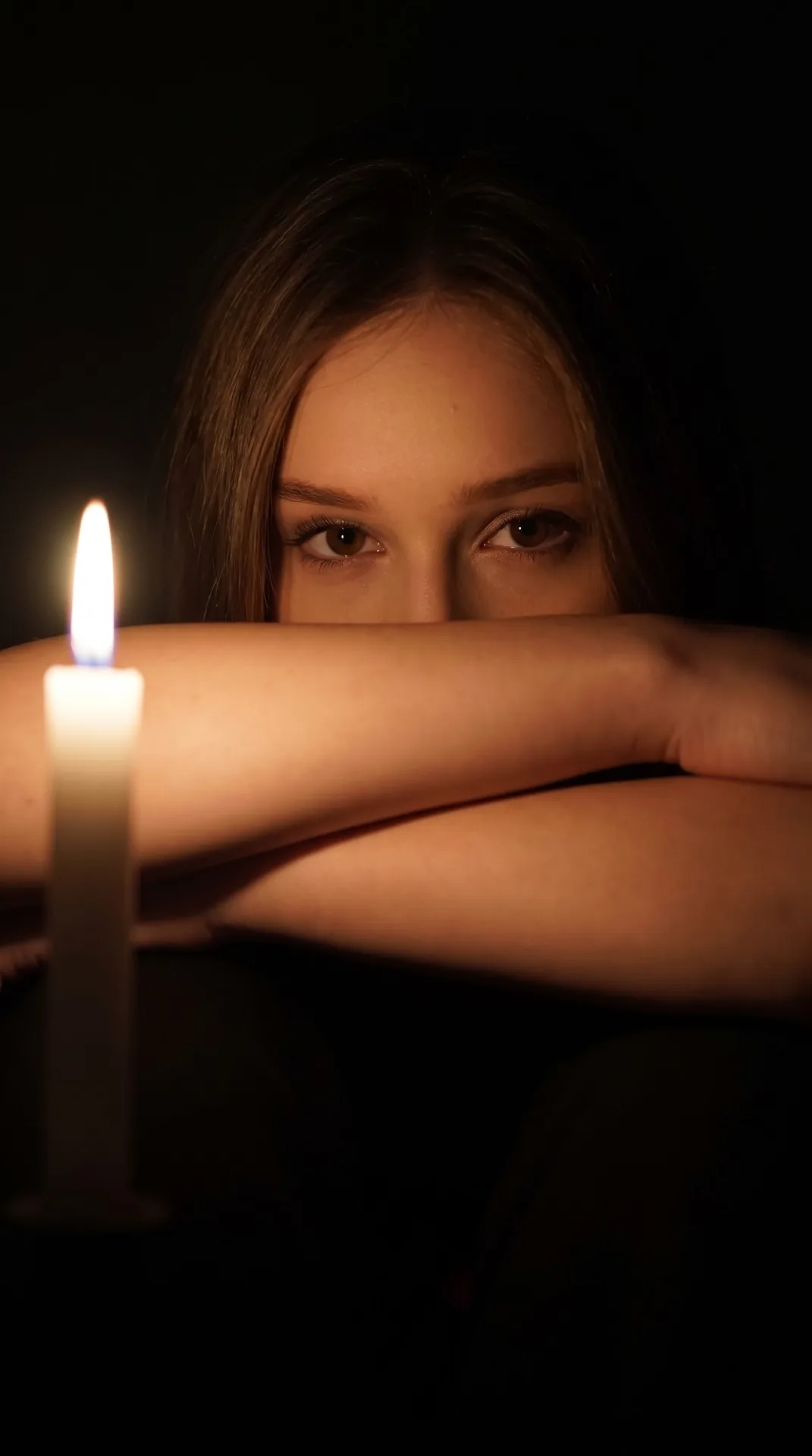 Prompt : Createa photo Ultra-realistic cinematic closeup low-light portrait of a woman (the reference image given)sitting in complete